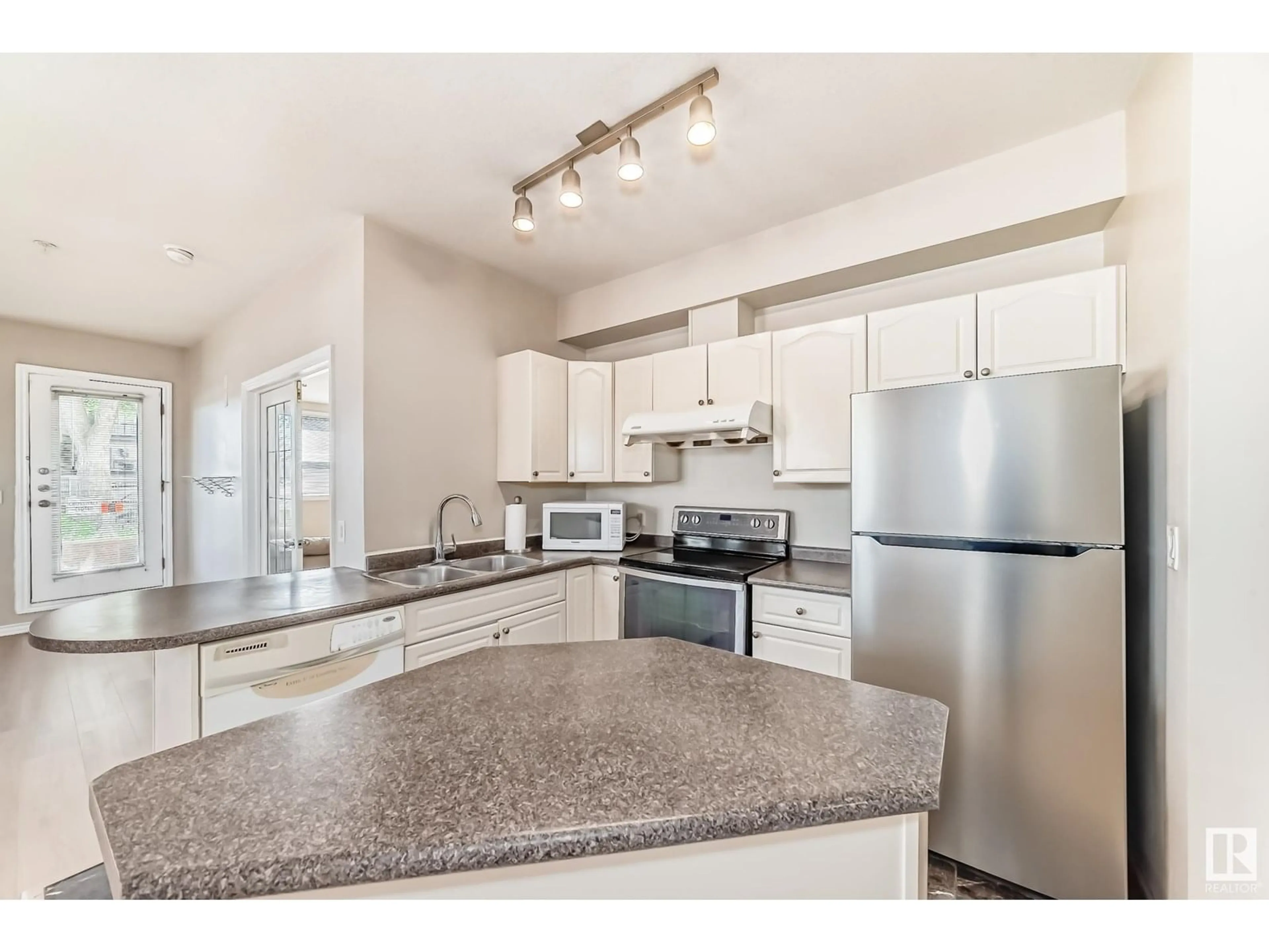 Open concept kitchen, unknown for #101 - 10346 117 ST, Edmonton Alberta T5K2Y7
