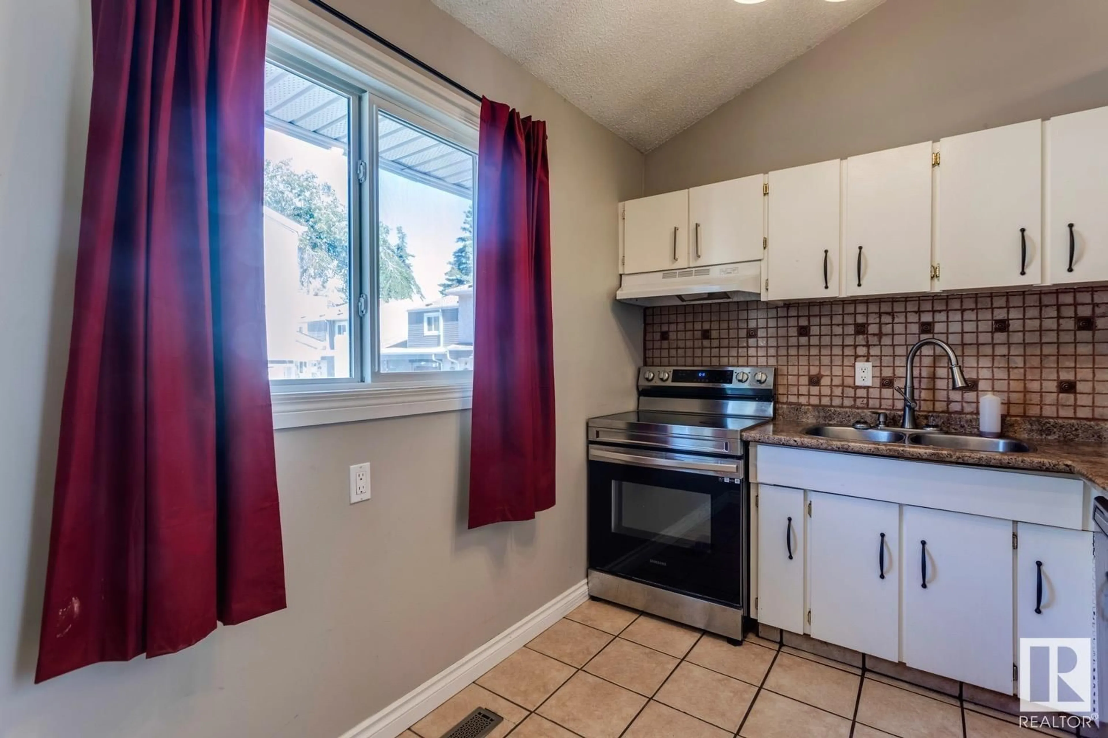 Standard kitchen, ceramic/tile floor for 5620 19A AV, Edmonton Alberta T6L2B9