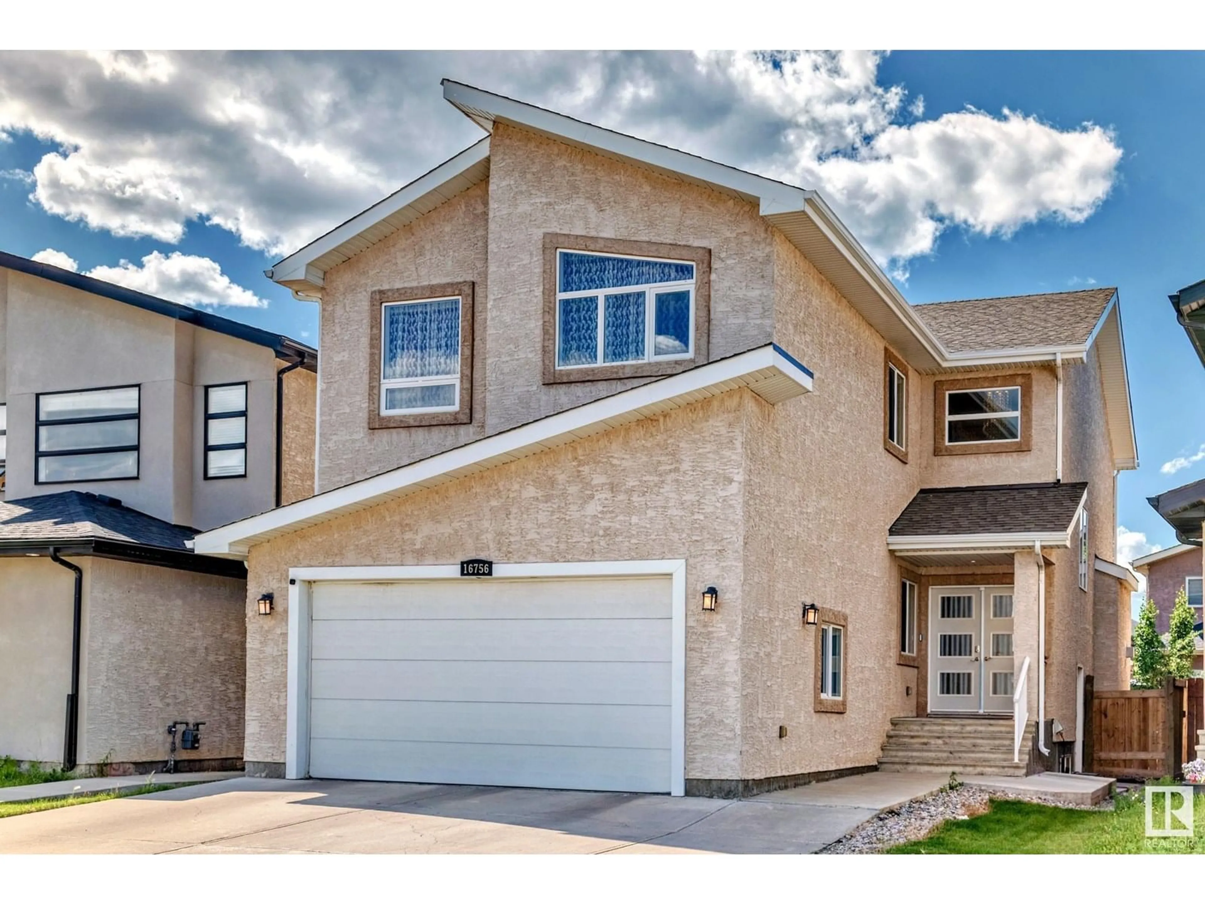 Home with vinyl exterior material, street for 16756 61 ST, Edmonton Alberta T5Y0W7