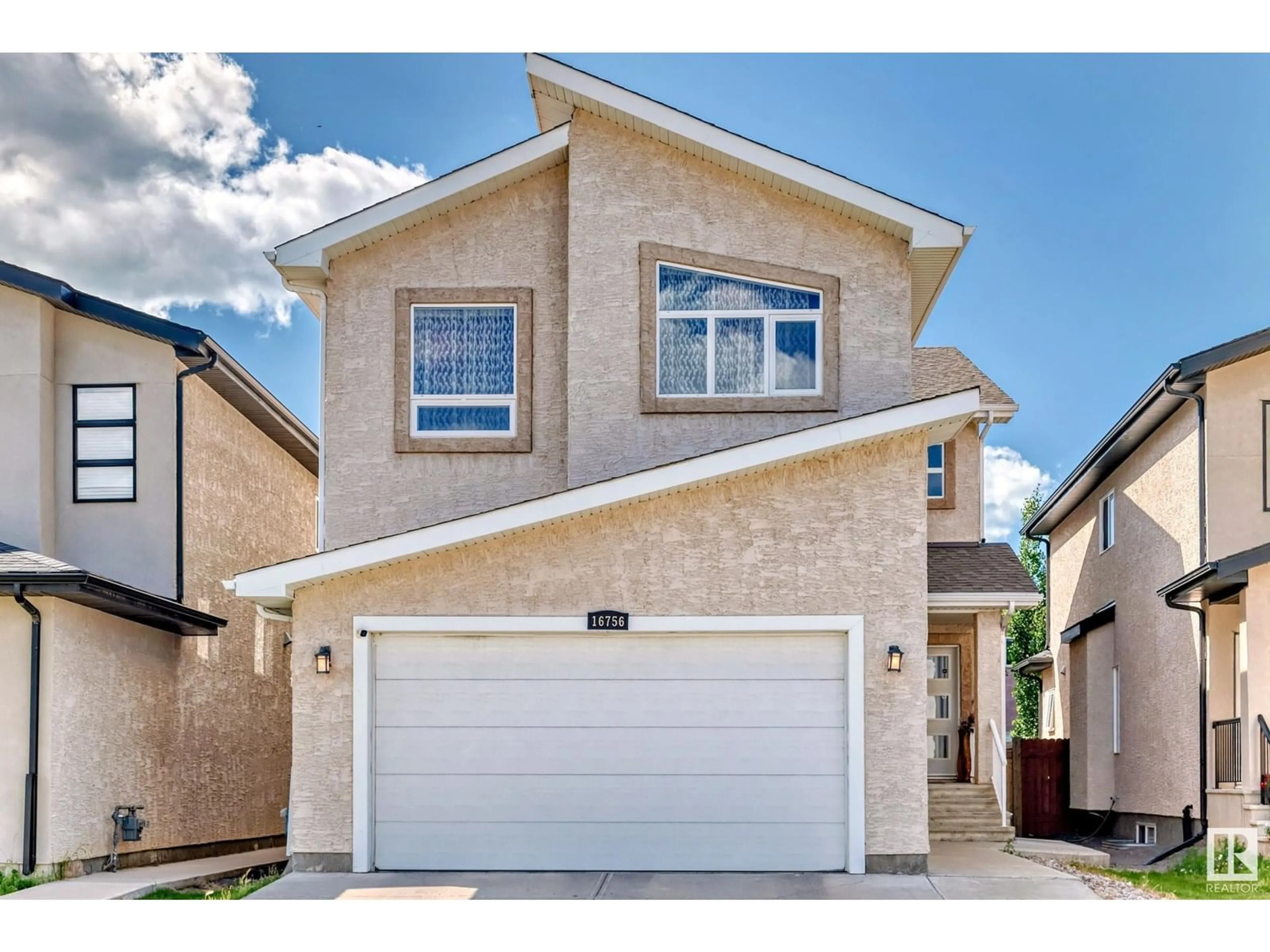 Home with vinyl exterior material, street for 16756 61 ST, Edmonton Alberta T5Y0W7