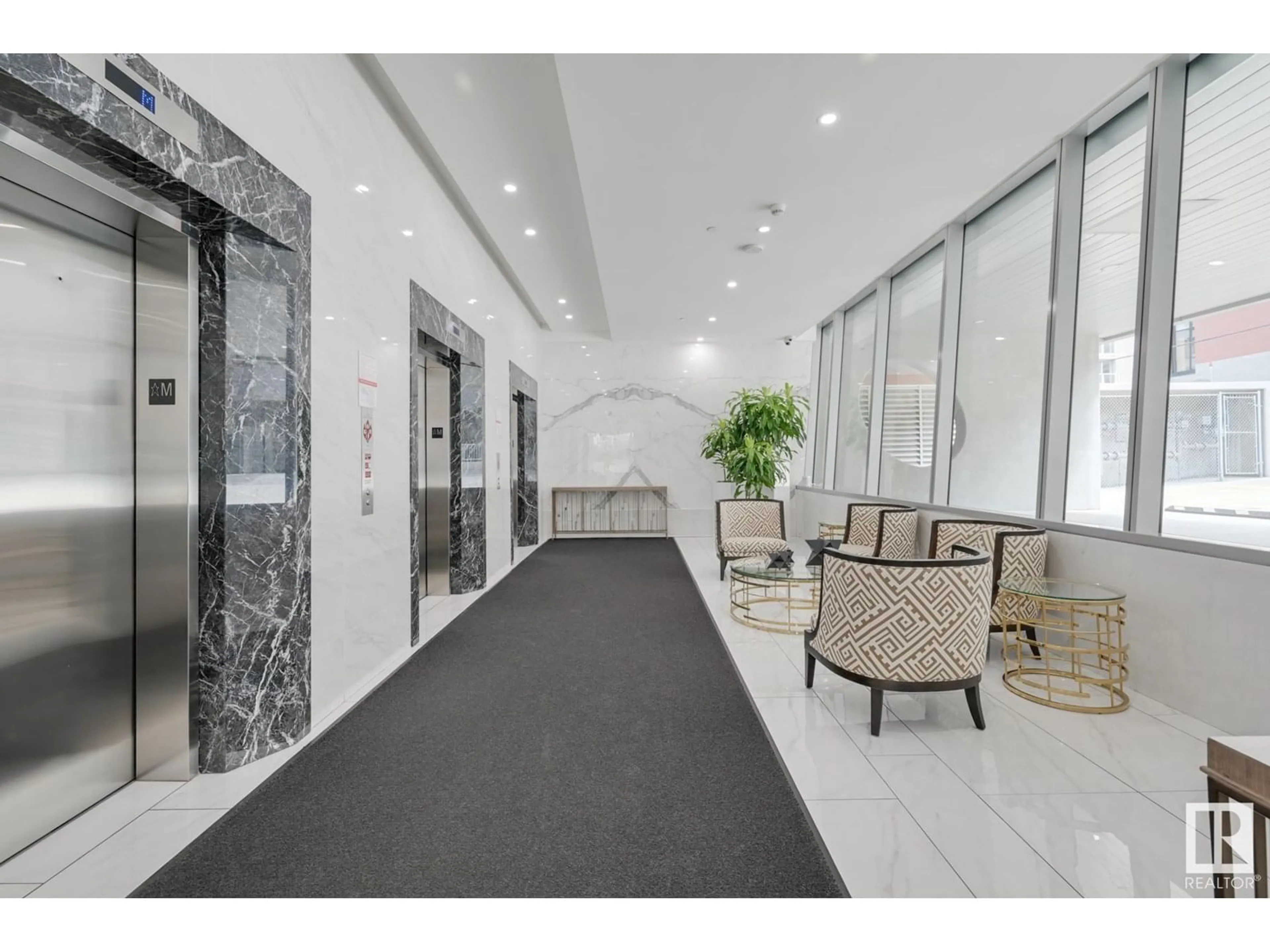 Indoor foyer for 11969 JASPER AV, Edmonton Alberta T5K0P1