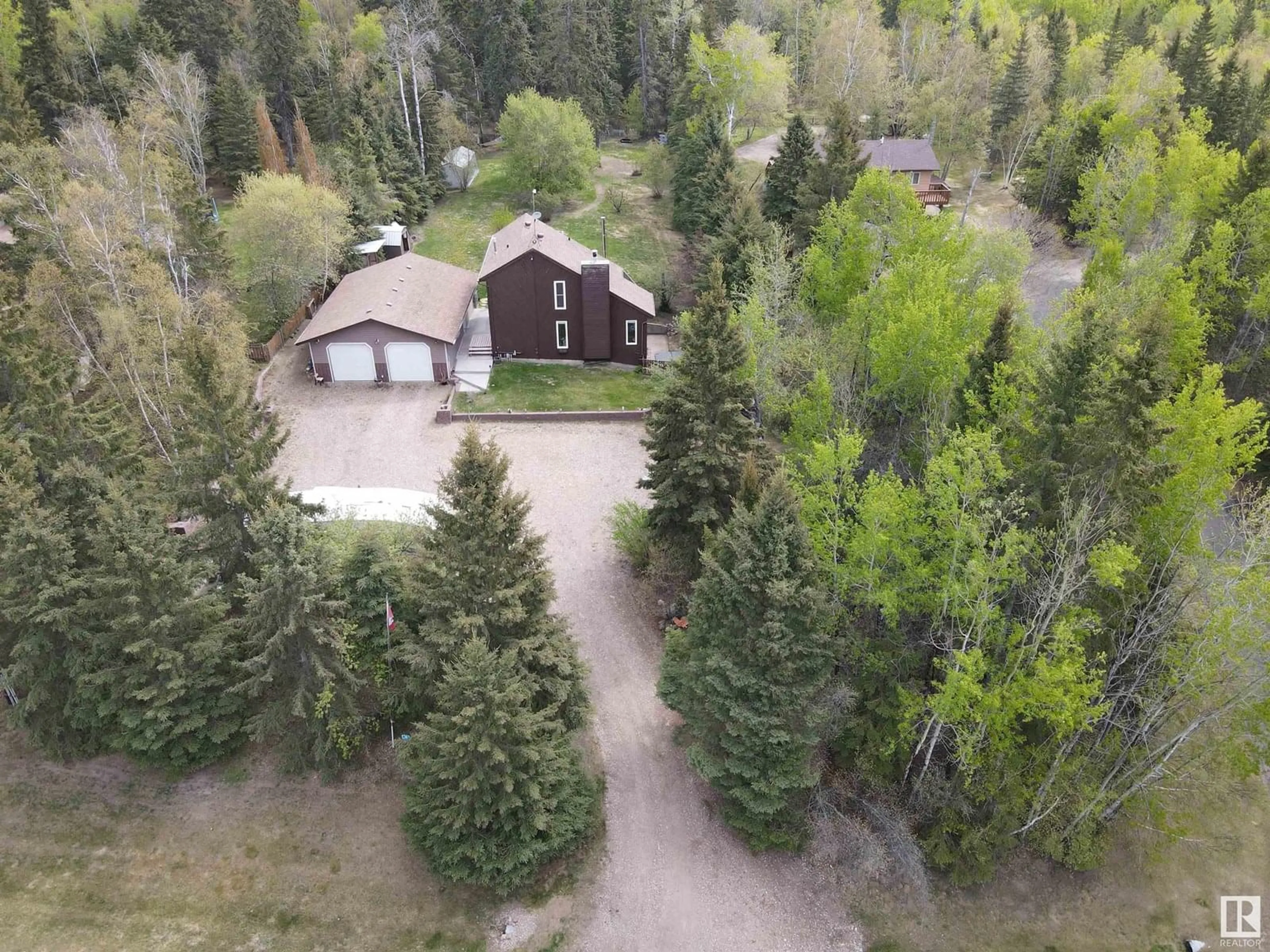 A pic from outside/outdoor area/front of a property/back of a property/a pic from drone, forest/trees view for #16 - 61223 RGE RD 470, Rural Bonnyville M.D. Alberta T9N2J6