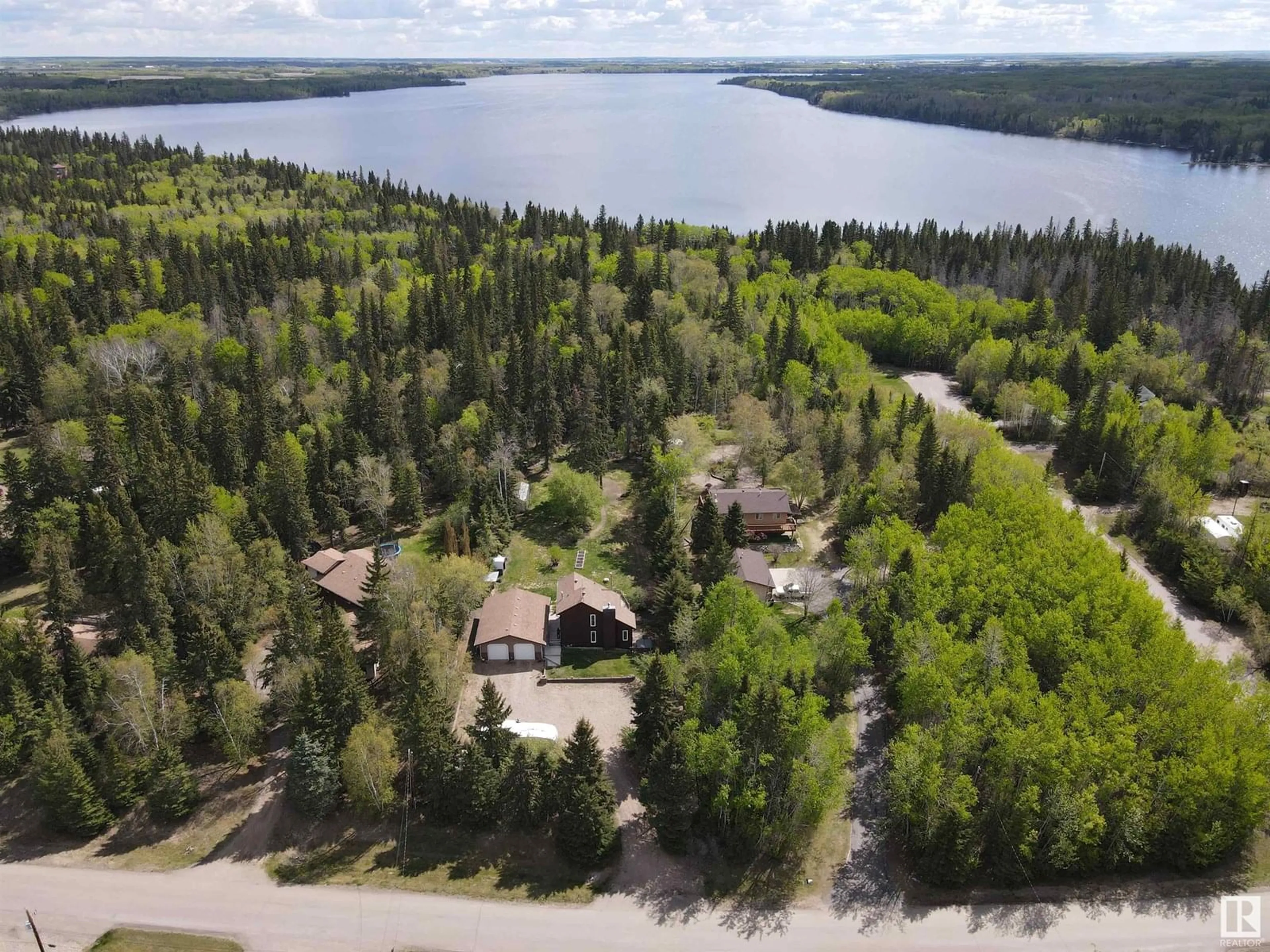 A pic from outside/outdoor area/front of a property/back of a property/a pic from drone, water/lake/river/ocean view for #16 - 61223 RGE RD 470, Rural Bonnyville M.D. Alberta T9N2J6