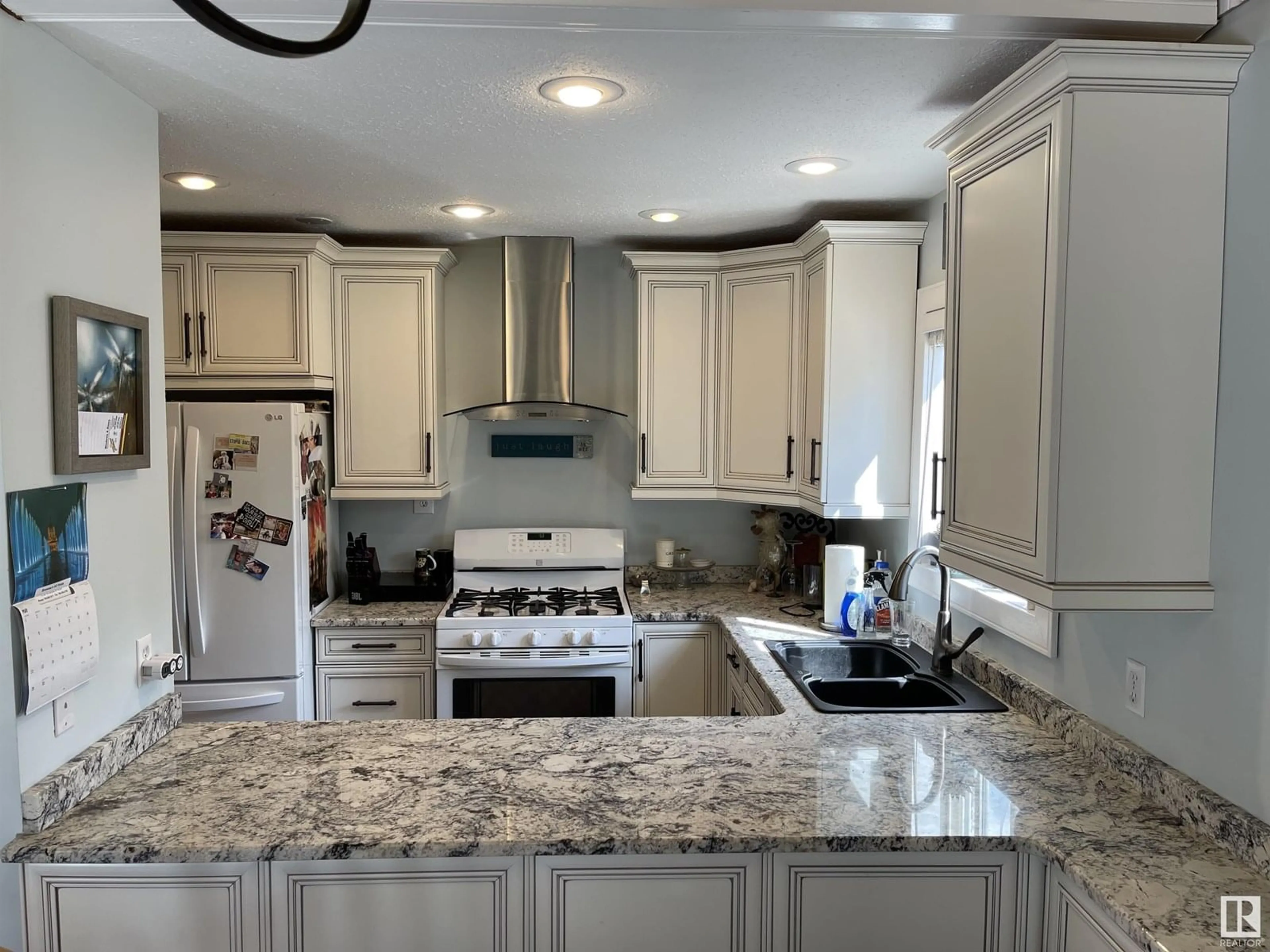 Open concept kitchen, ceramic/tile floor for #16 - 61223 RGE RD 470, Rural Bonnyville M.D. Alberta T9N2J6