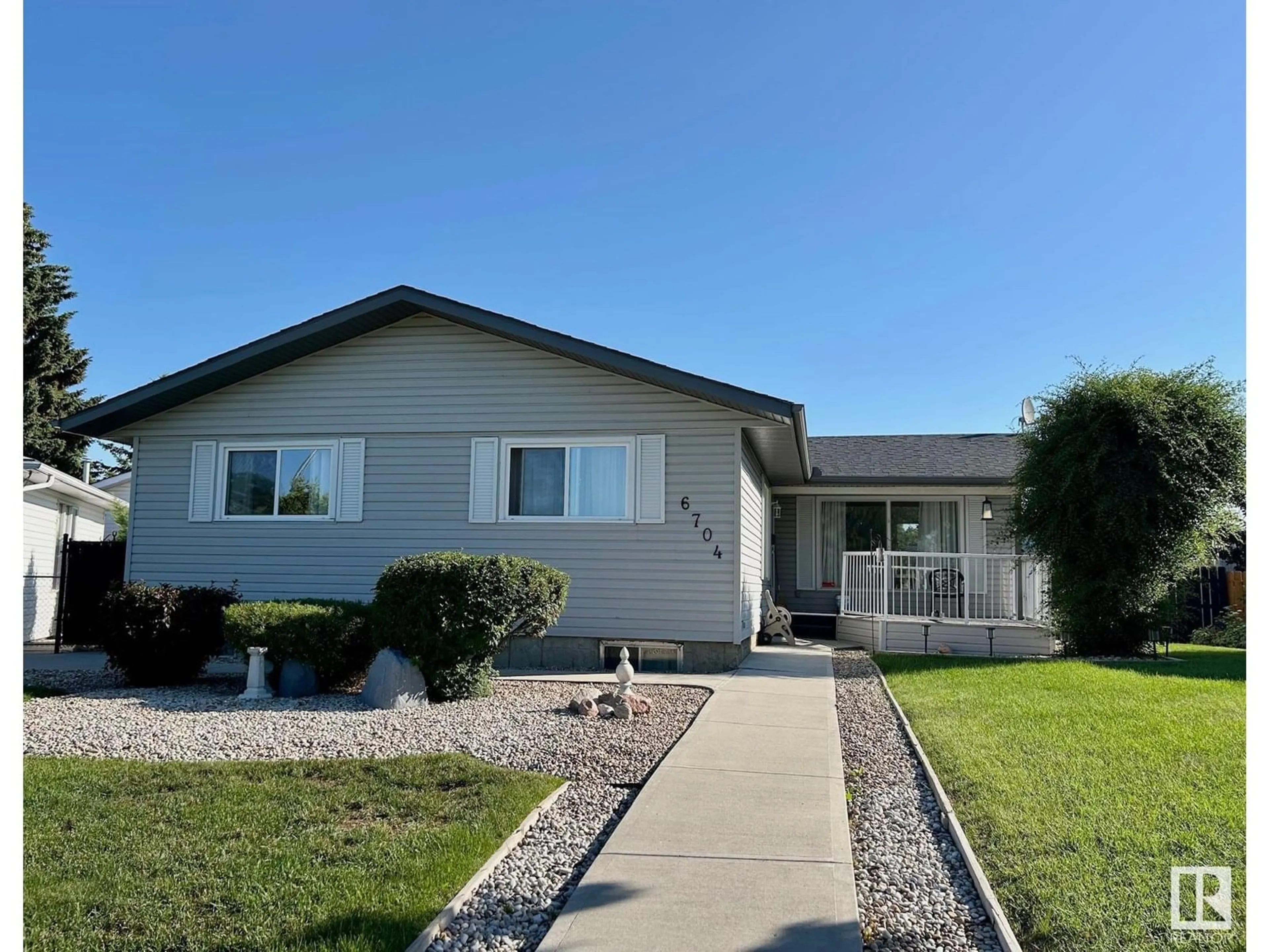 Home with vinyl exterior material, street for 6704 152A AV, Edmonton Alberta T5C2Y9