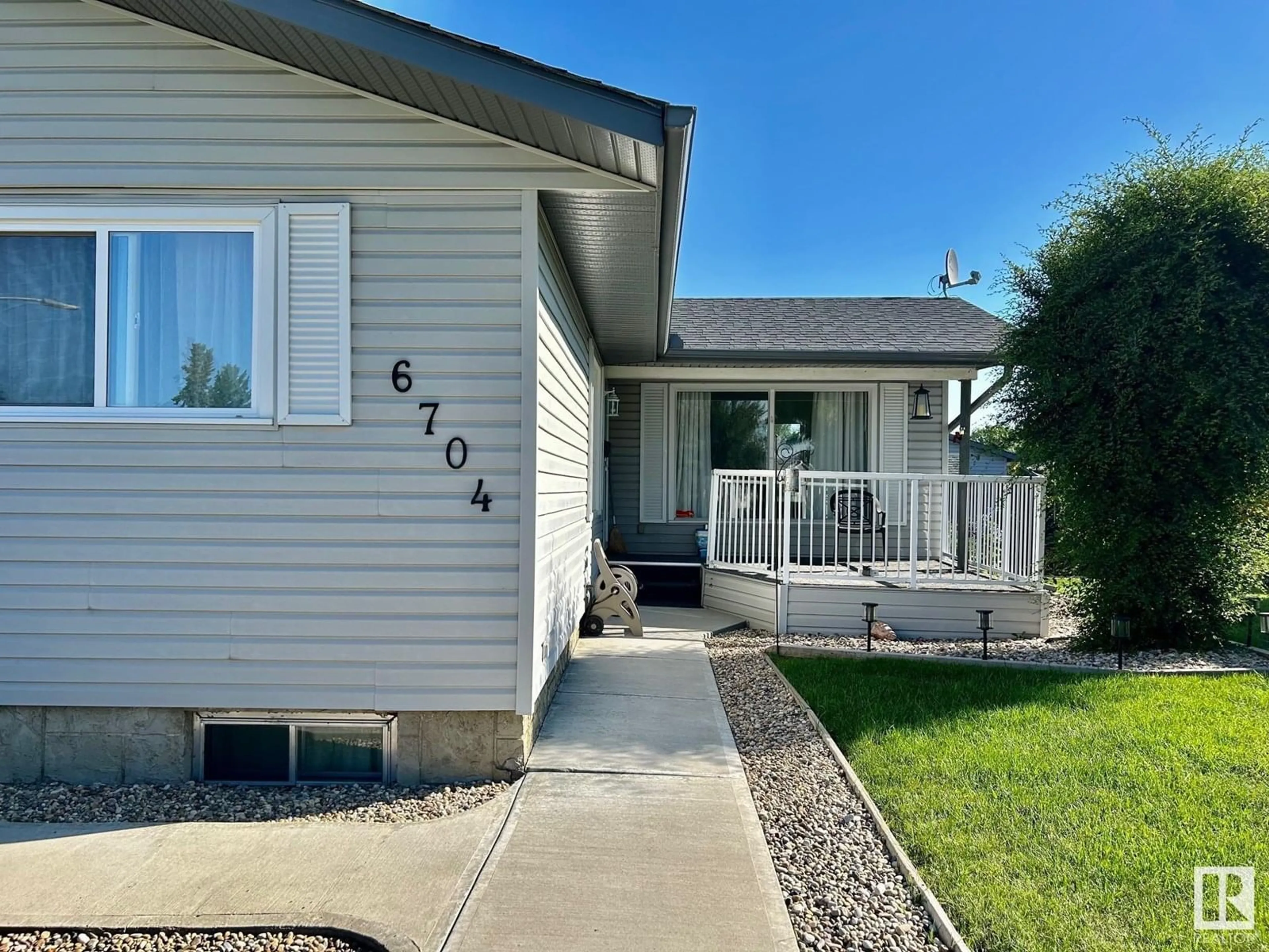 Home with vinyl exterior material, street for 6704 152A AV, Edmonton Alberta T5C2Y9
