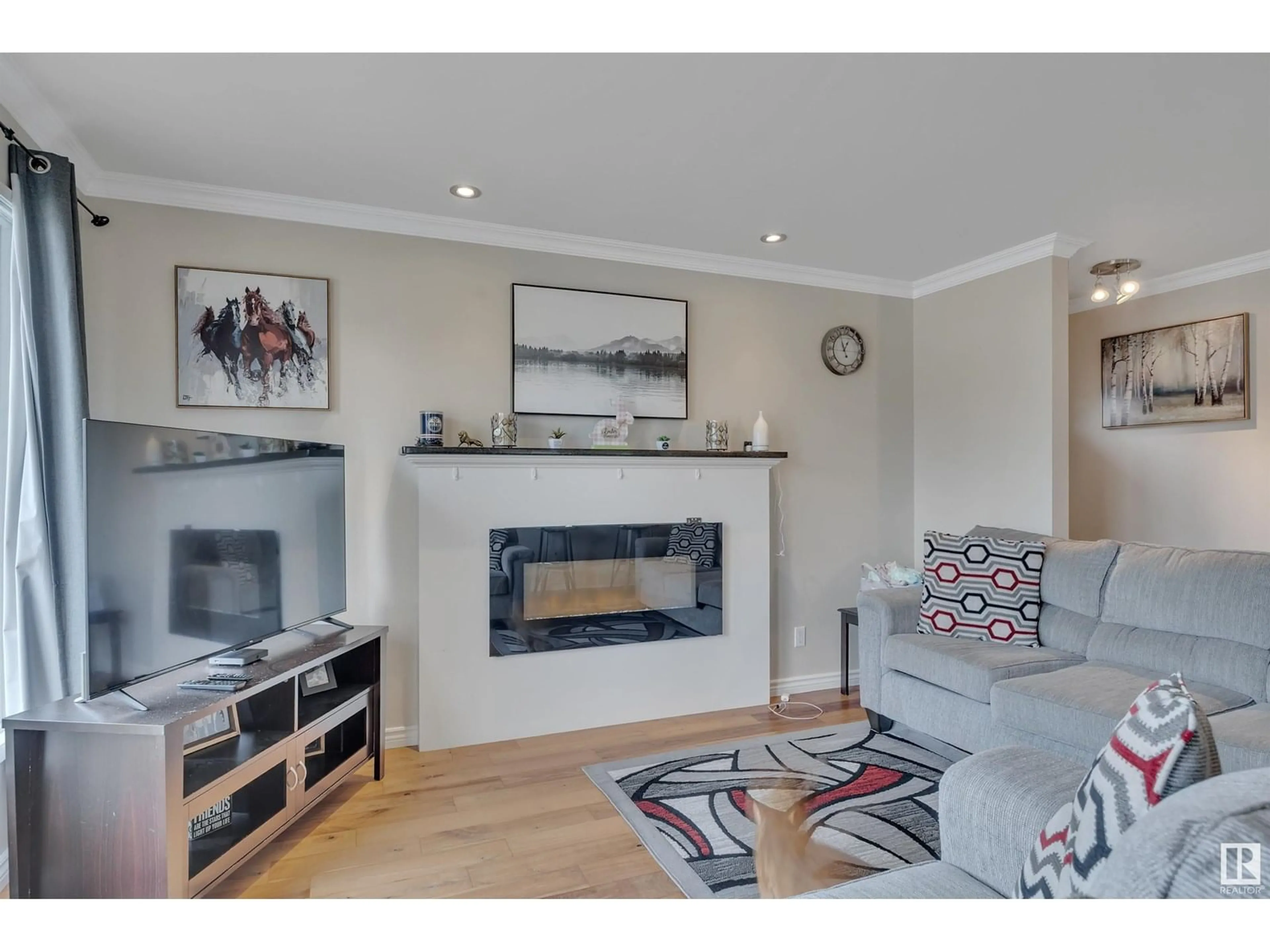 Living room with furniture, wood/laminate floor for 6428 15 AV, Edmonton Alberta T6L1S6