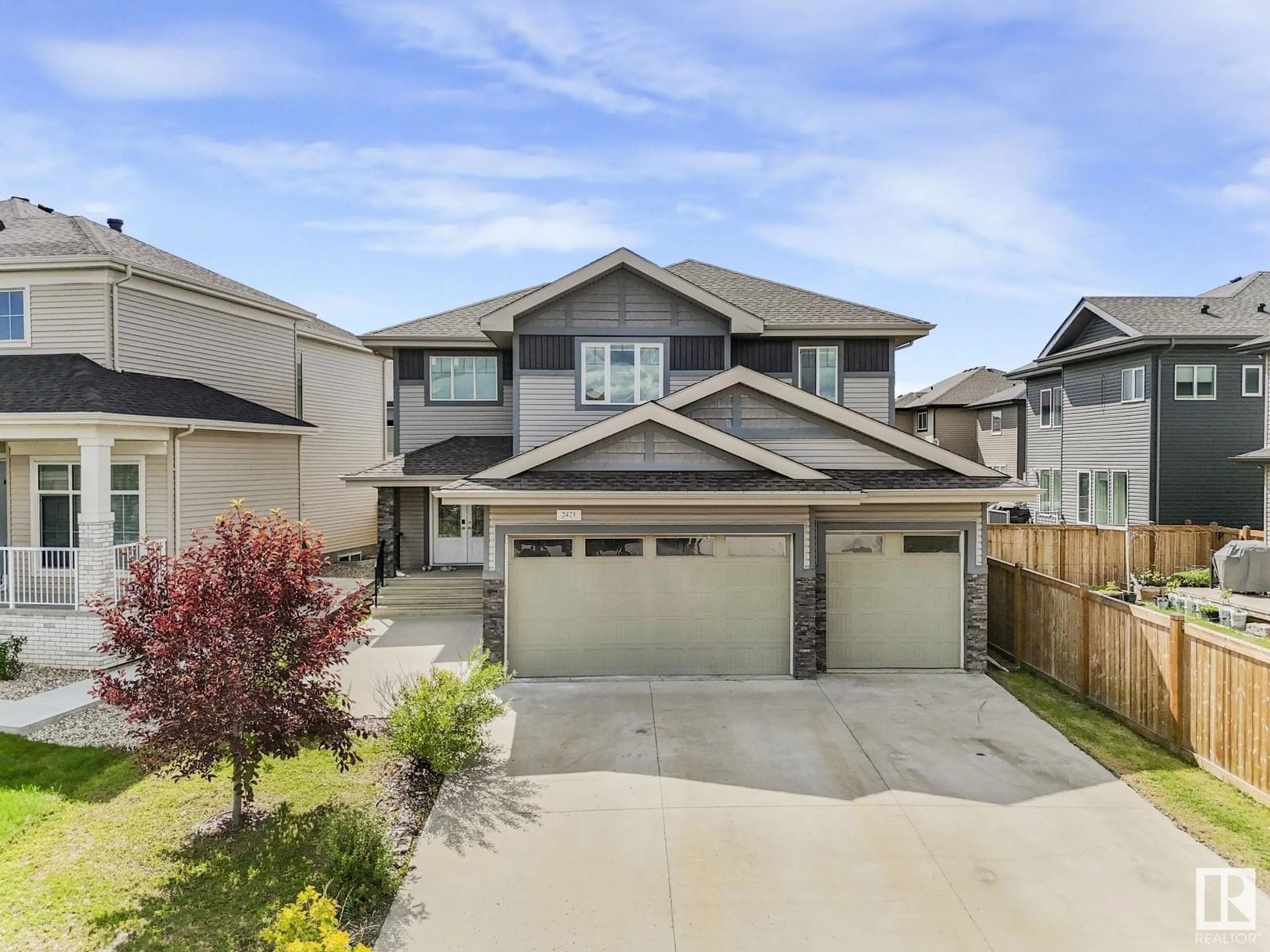 Home with vinyl exterior material, street for 2421 ASHCRAFT CR, Edmonton Alberta T6W2M9