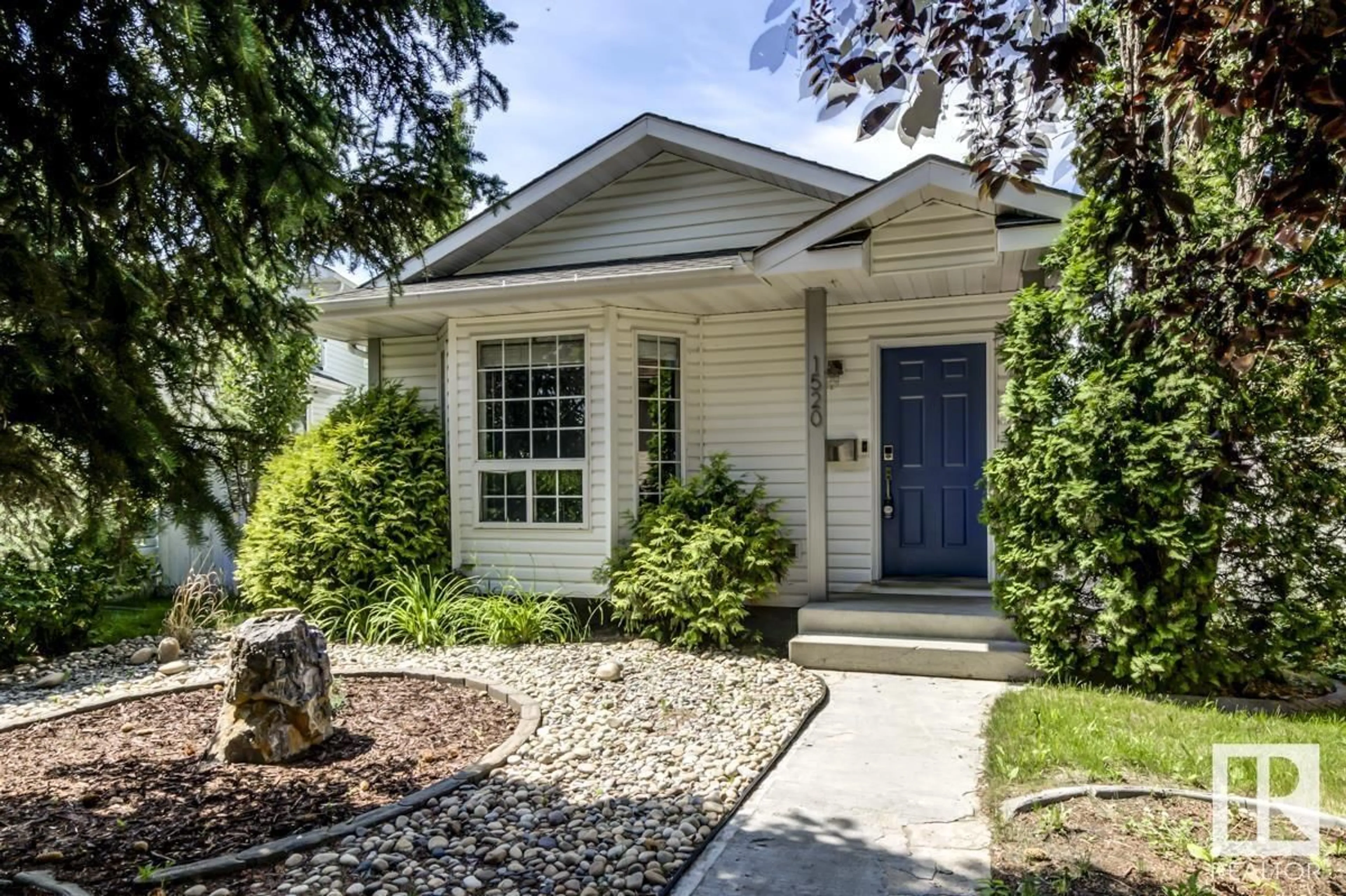 Home with vinyl exterior material, street for 1520 80A ST, Edmonton Alberta T6K4E2