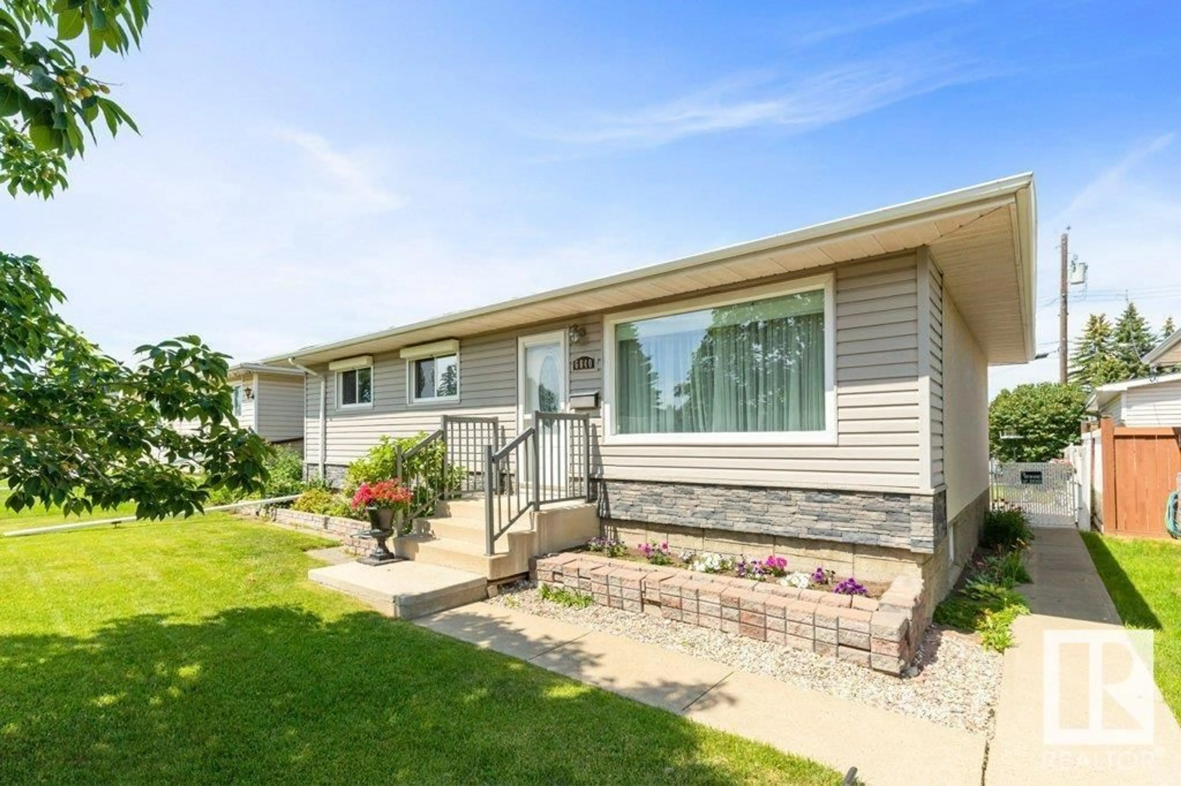 Home with vinyl exterior material, street for 6840 83 AV, Edmonton Alberta T6B0G5