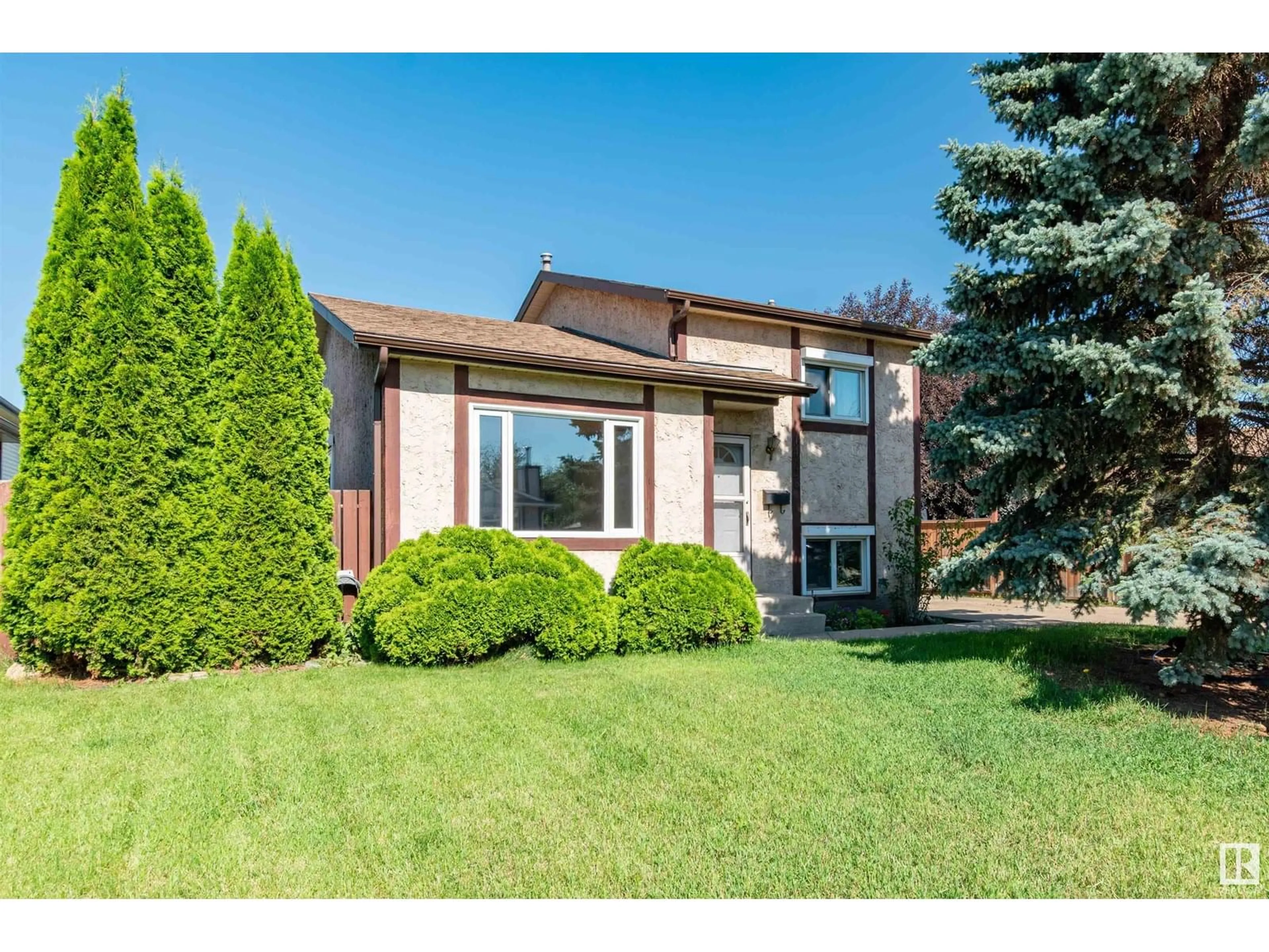 Home with vinyl exterior material, street for 14528 29 ST, Edmonton Alberta T5Y2L4