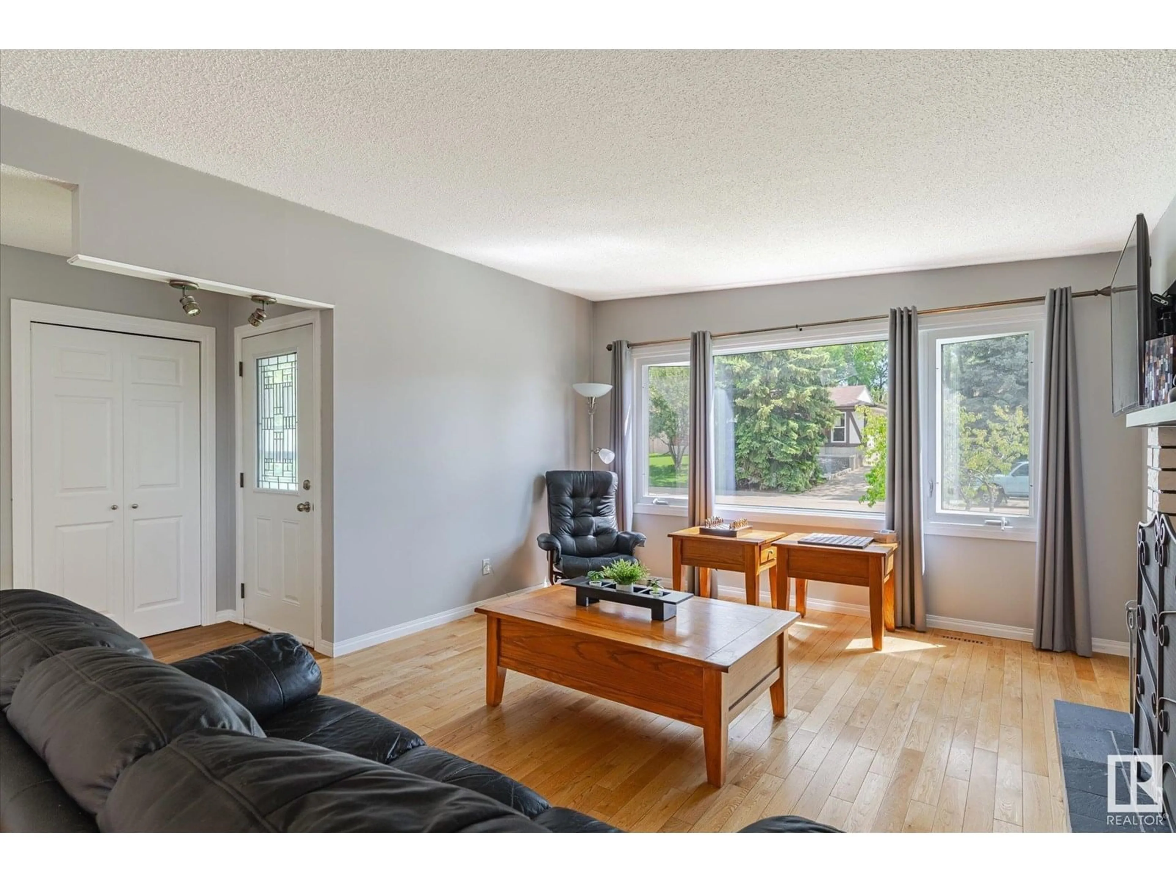 Living room with furniture, wood/laminate floor for 19 GARFIELD CR, Sherwood Park Alberta T8A3L6
