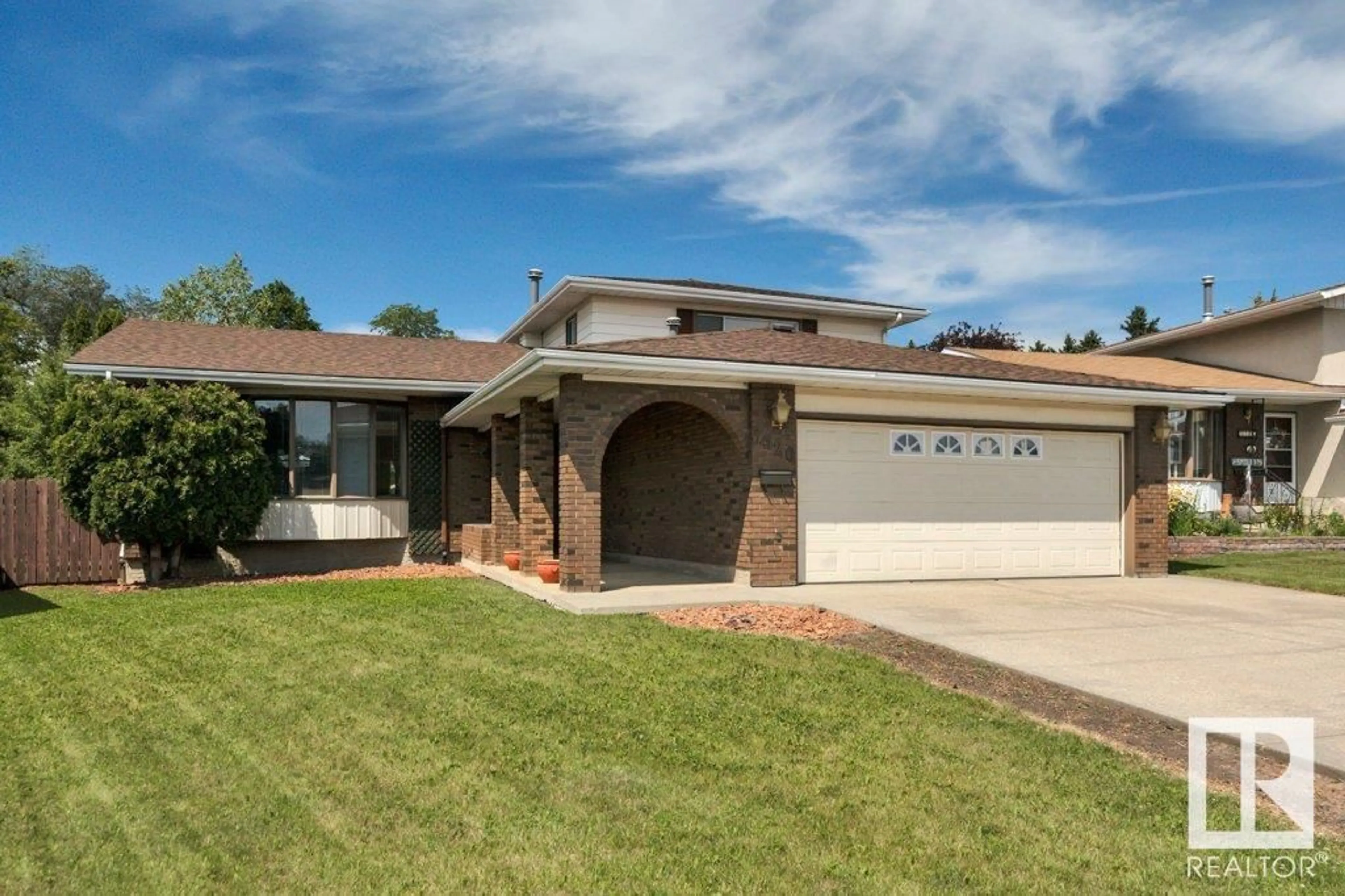 Home with brick exterior material, street for 3520 103 AV, Edmonton Alberta T5W0A7