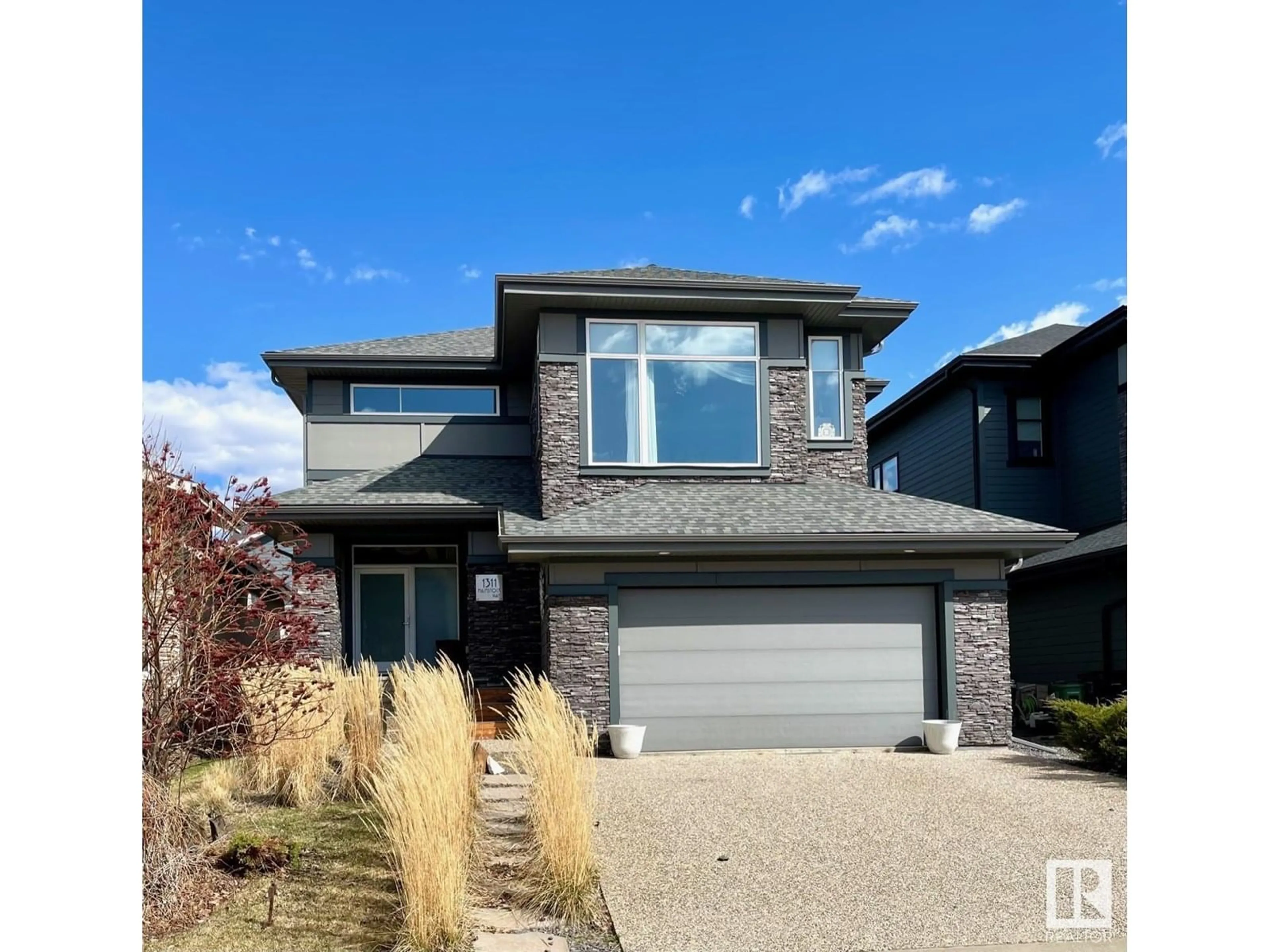 Home with brick exterior material, street for 1311 HAINSTOCK WY, Edmonton Alberta T6W3B6