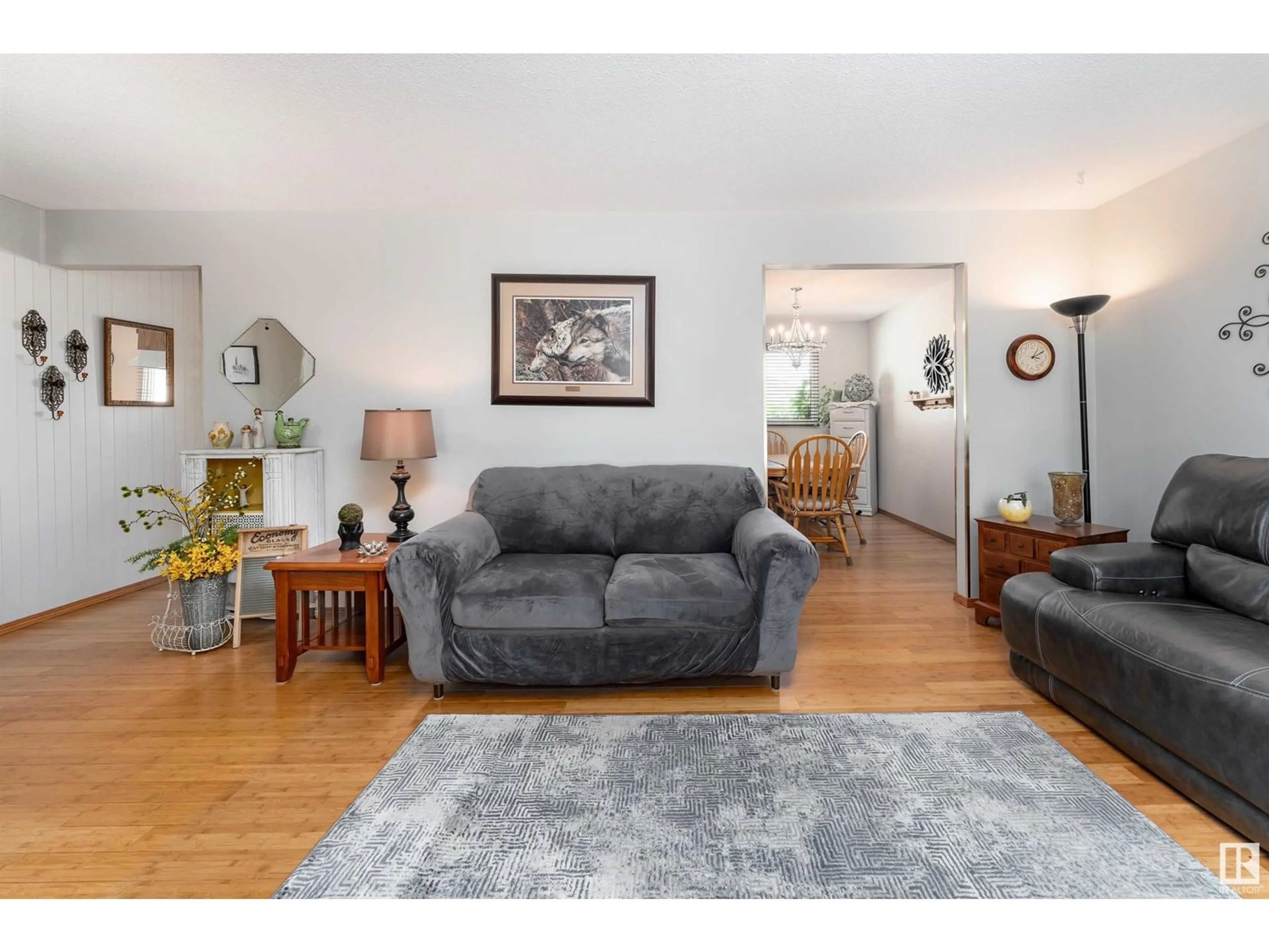 Living room with furniture, wood/laminate floor for 8513 92 AV, Fort Saskatchewan Alberta T8L1A1