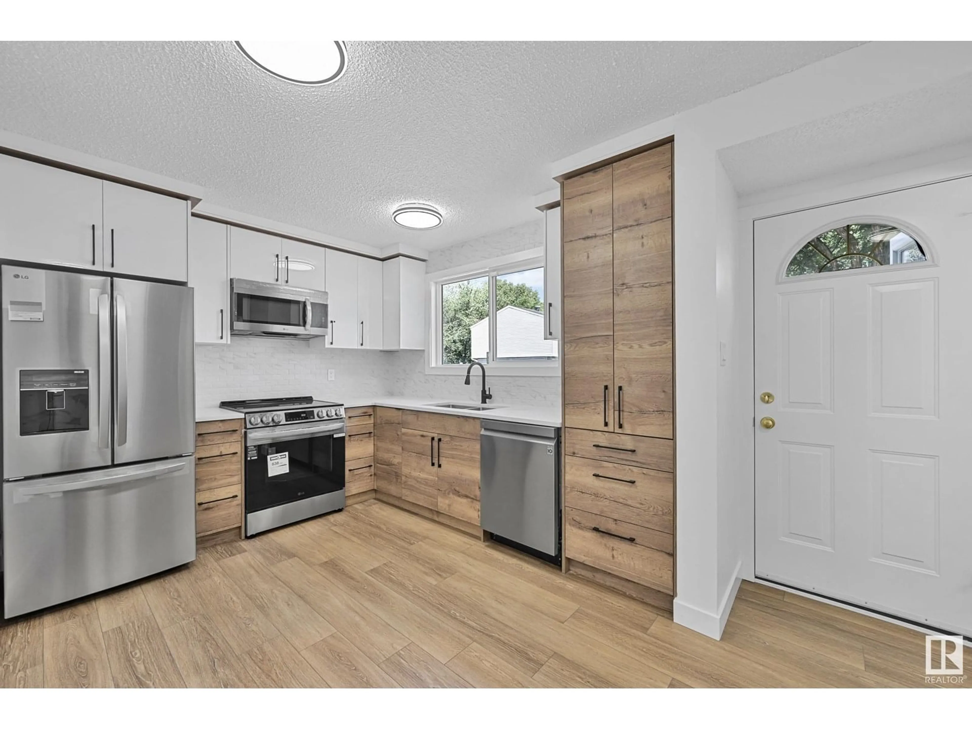 Open concept kitchen, wood/laminate floor for 416 HERMITAGE RD, Edmonton Alberta T5A3K9