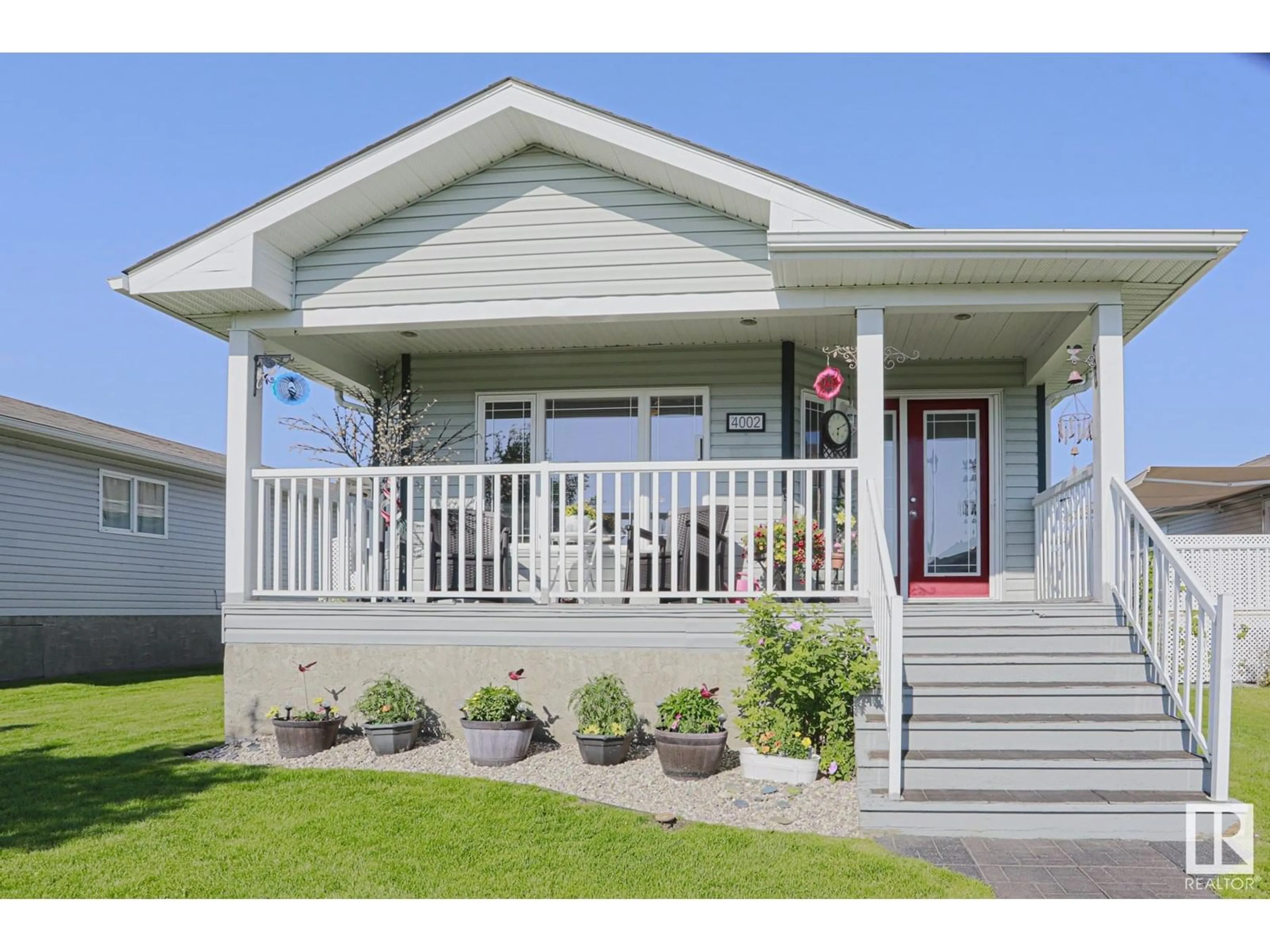 Home with vinyl exterior material, street for 4002 ASPEN WY, Leduc Alberta T9E8P9