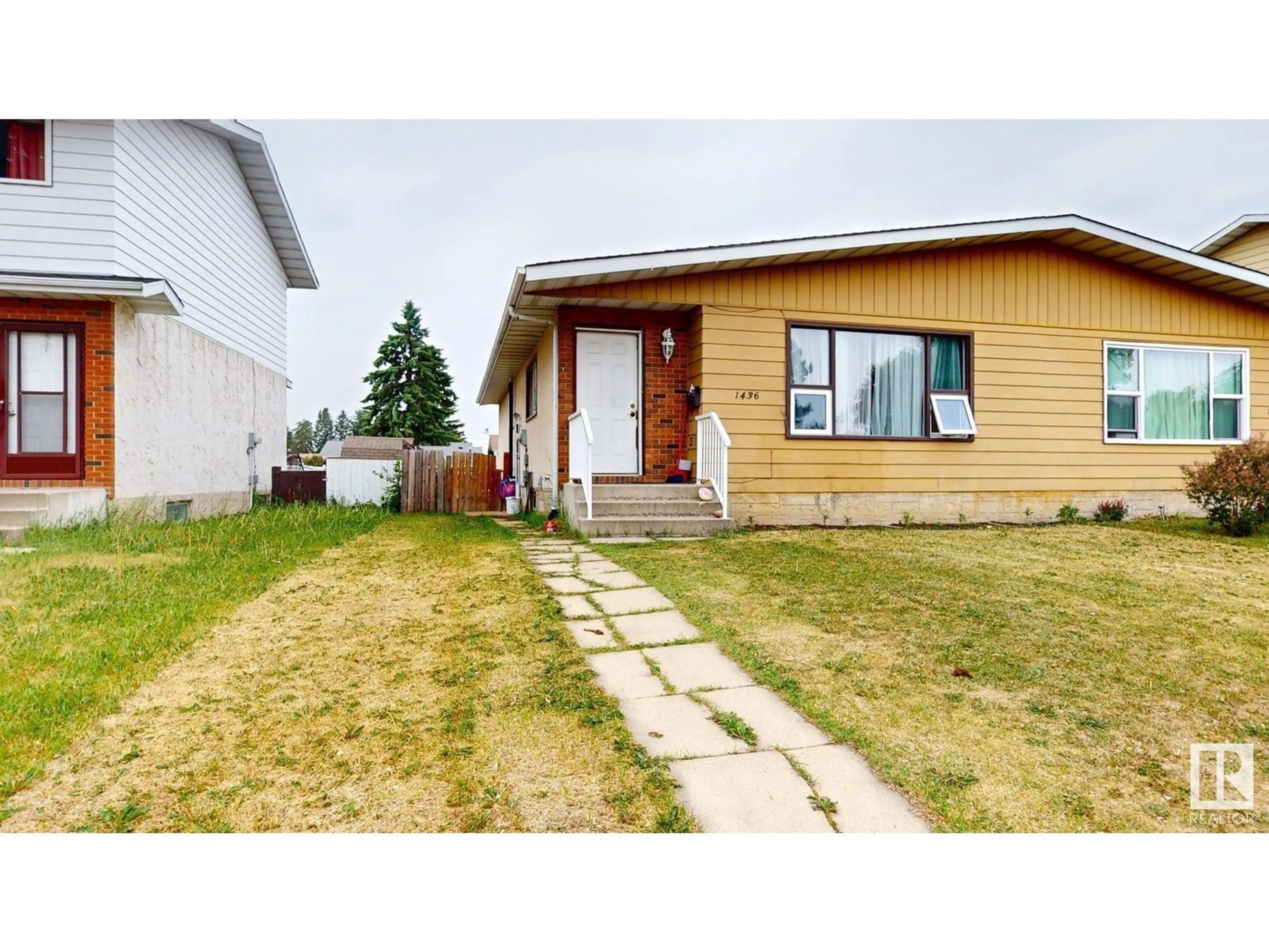 Home with vinyl exterior material, street for 1436 62 ST, Edmonton Alberta T6L1S8