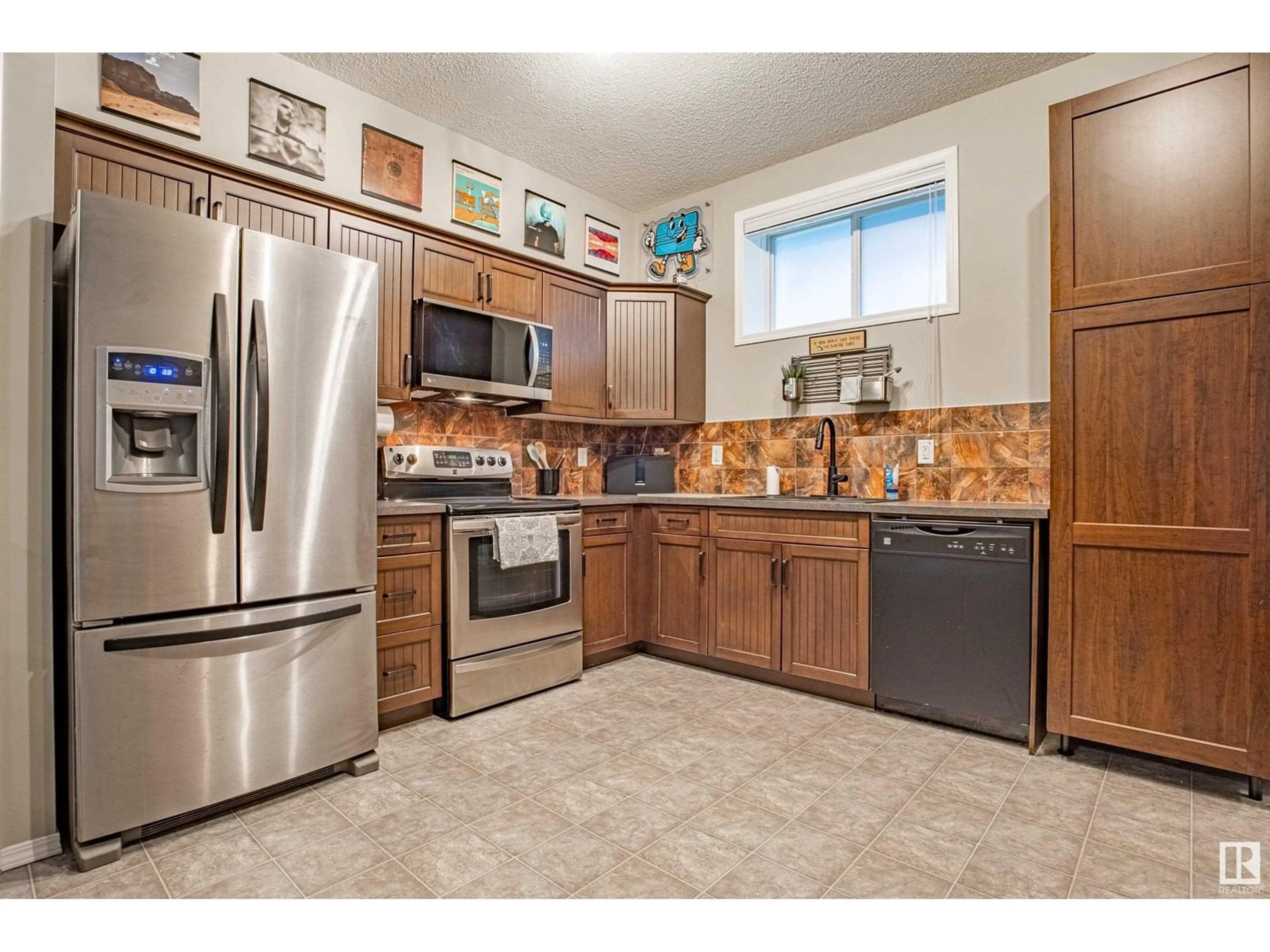 Open concept kitchen, ceramic/tile floor for #102 - 142 SELKIRK PL, Leduc Alberta T9E0M9