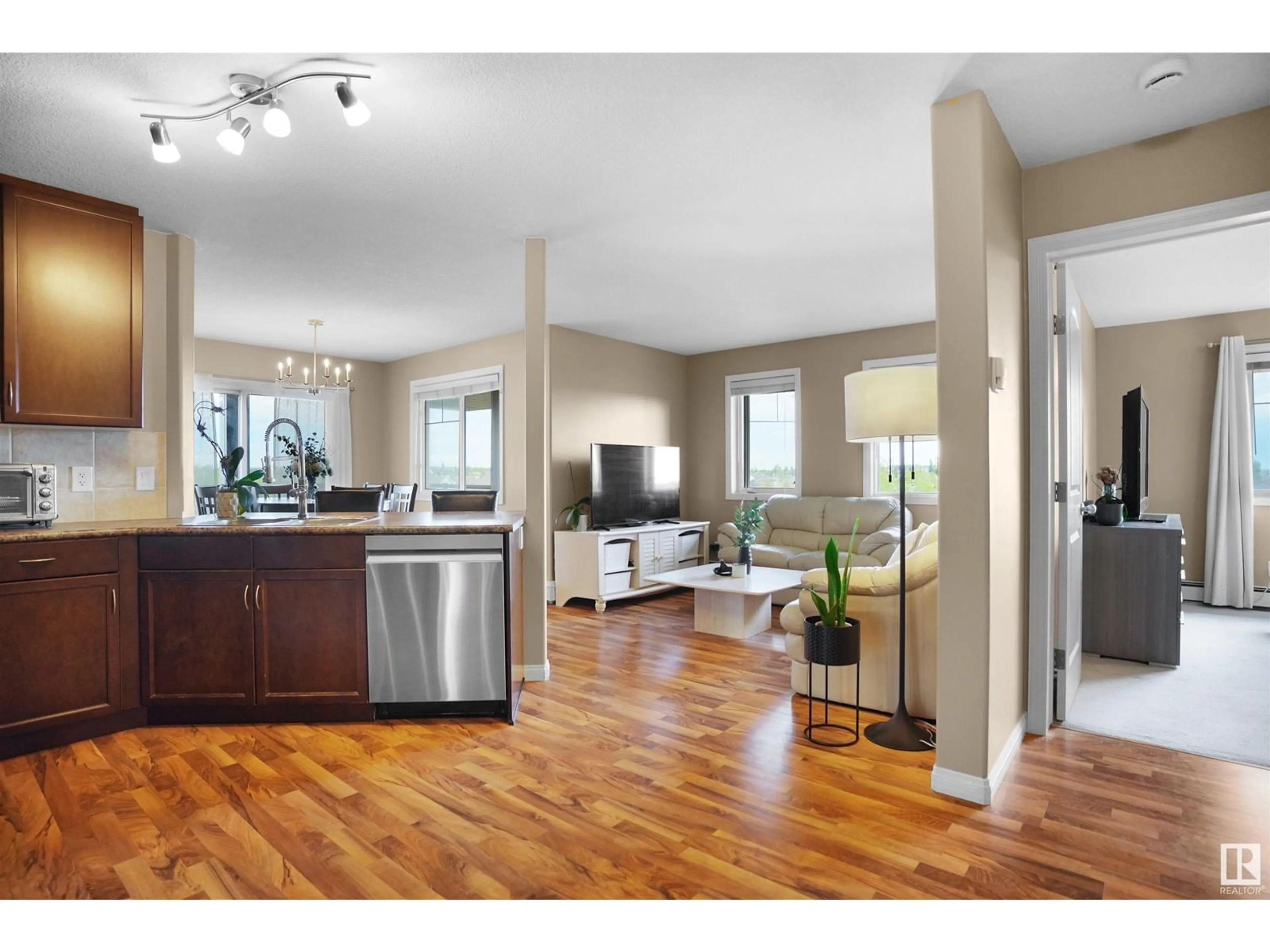 Open concept kitchen, wood/laminate floor for 418 - 1204 156 ST NW, Edmonton Alberta T6R0R6