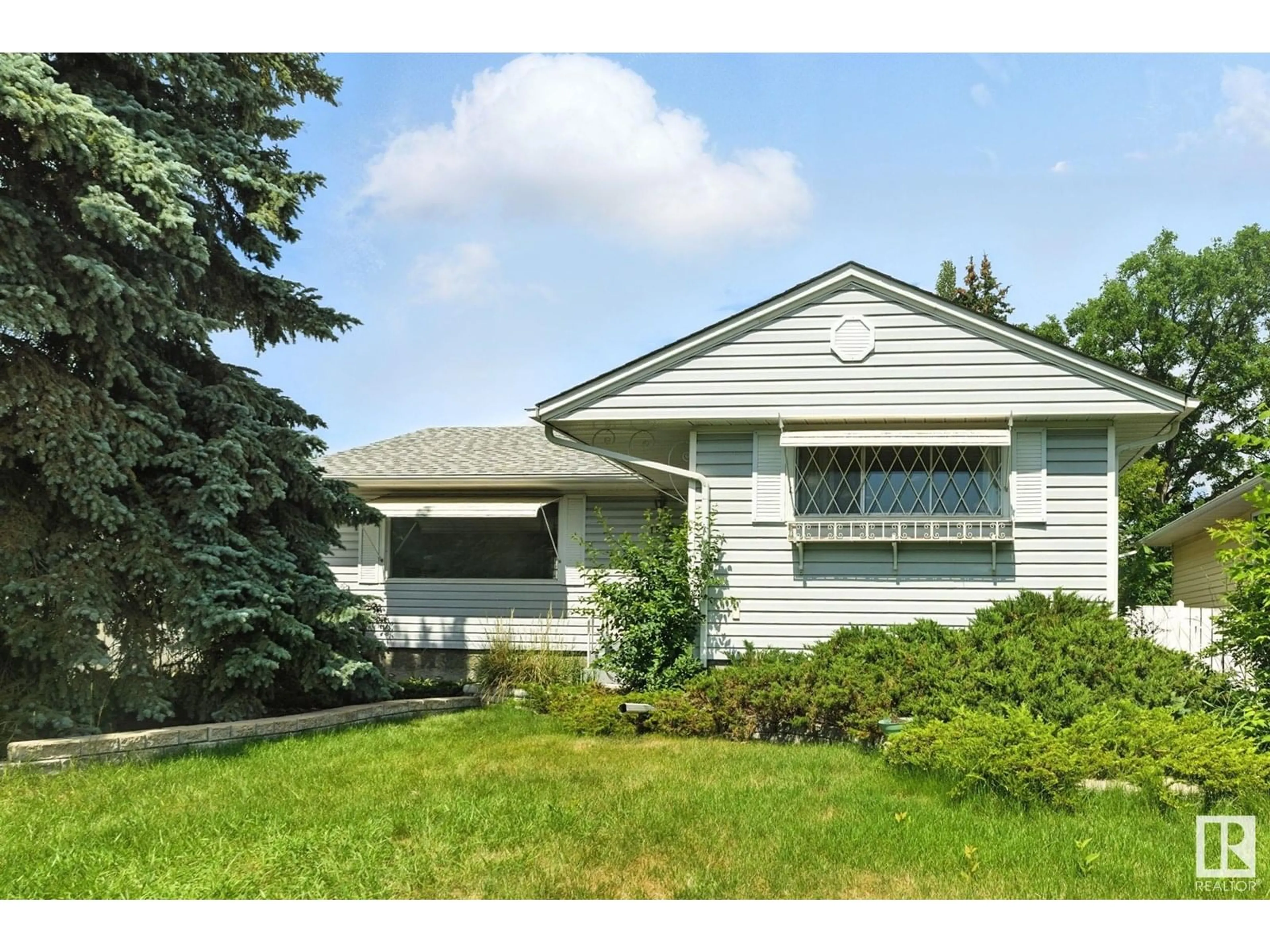 Home with vinyl exterior material, street for 15934 94 AV, Edmonton Alberta T5R5K8