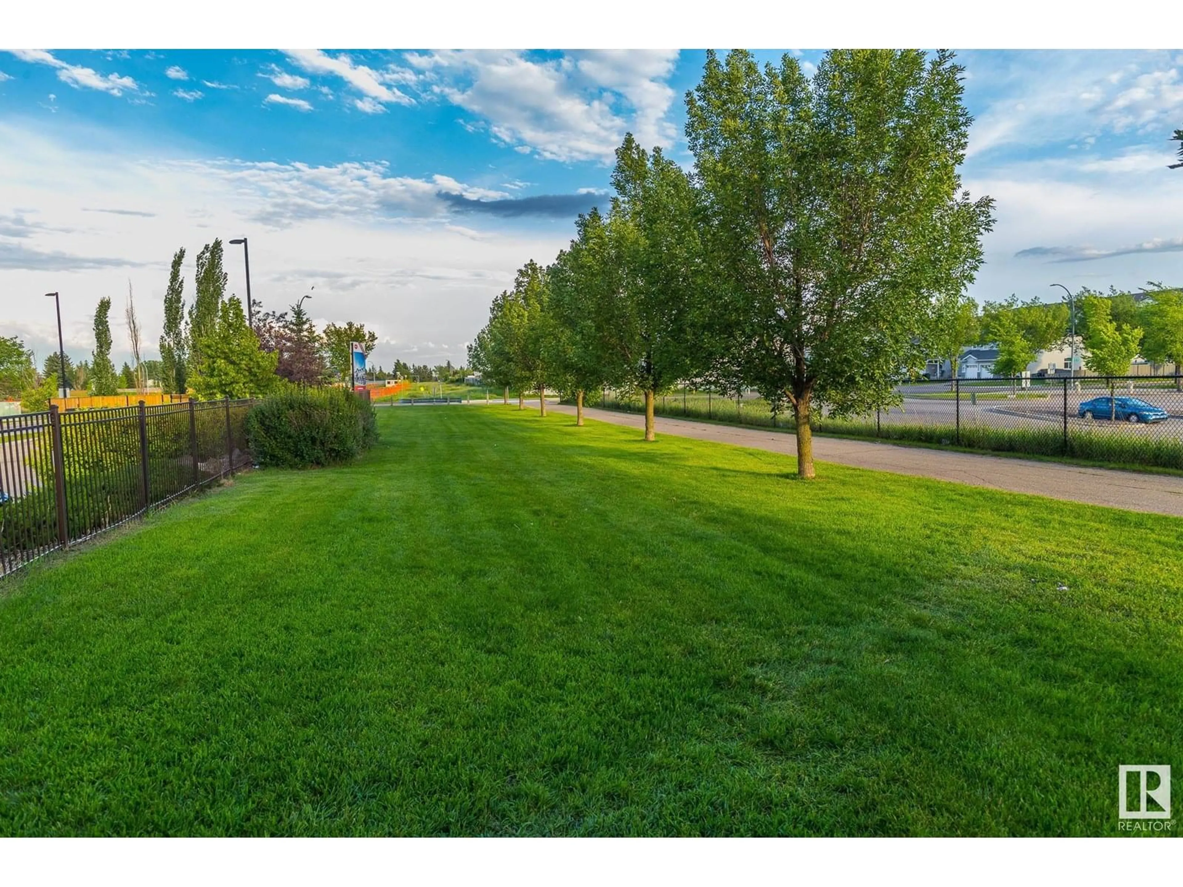 A pic from outside/outdoor area/front of a property/back of a property/a pic from drone, water/lake/river/ocean view for 319 - 3670 139 AV NW, Edmonton Alberta T5Y3N5