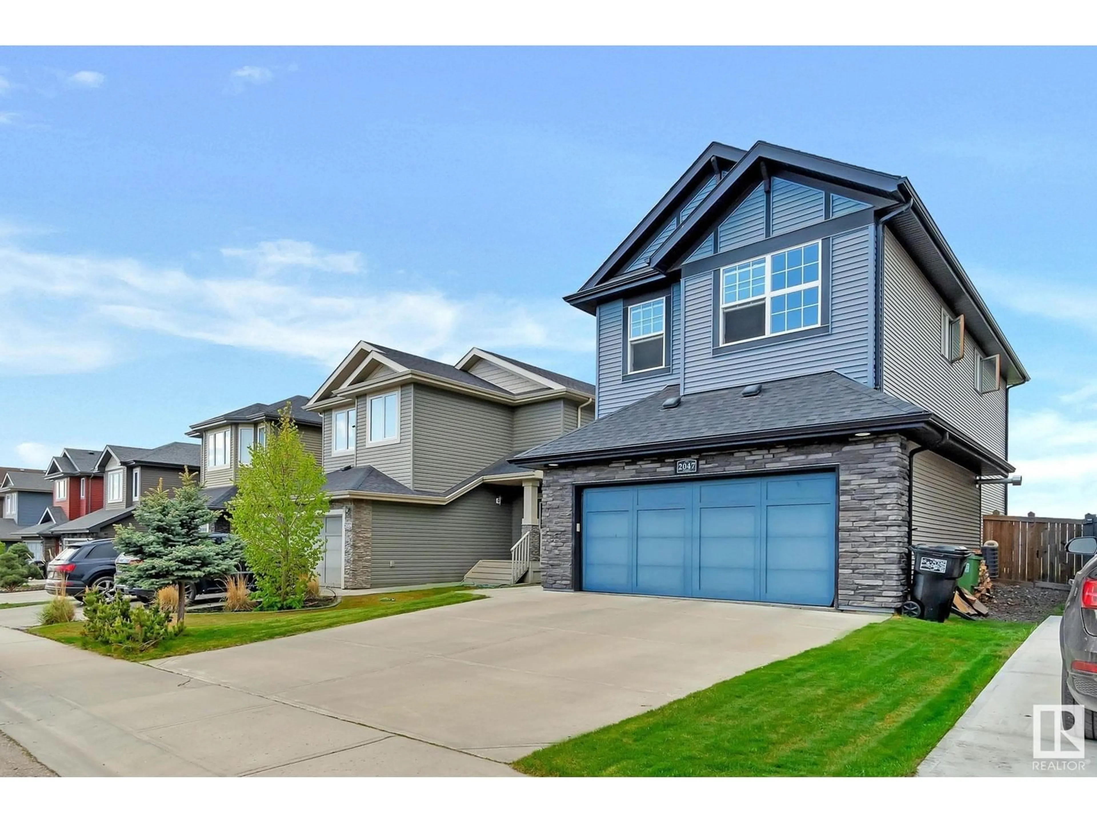 Home with vinyl exterior material, street for 2047 REDTAIL CM, Edmonton Alberta T5S0H3