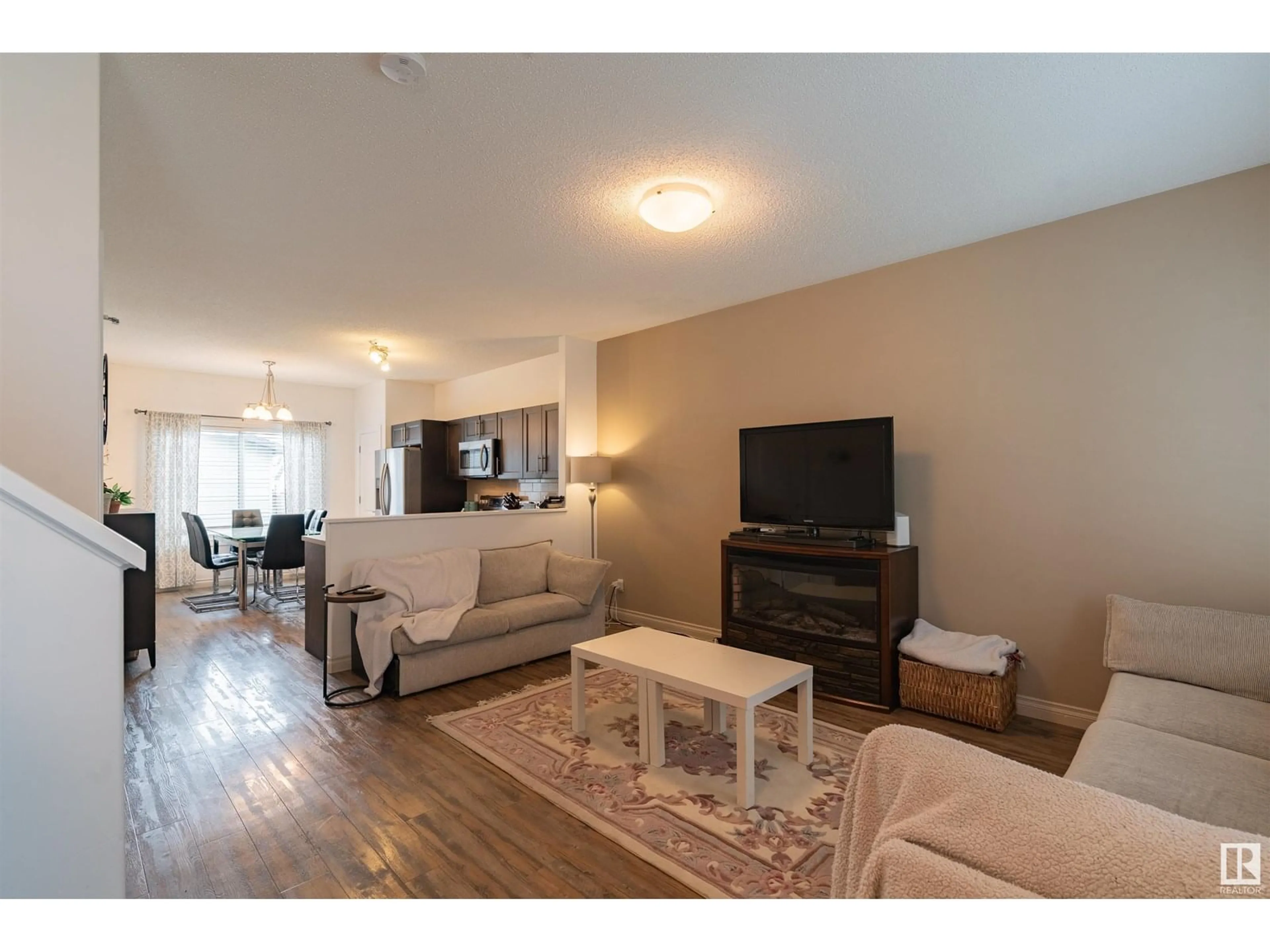 Living room with furniture, wood/laminate floor for 16728 120 ST, Edmonton Alberta T5X0G5