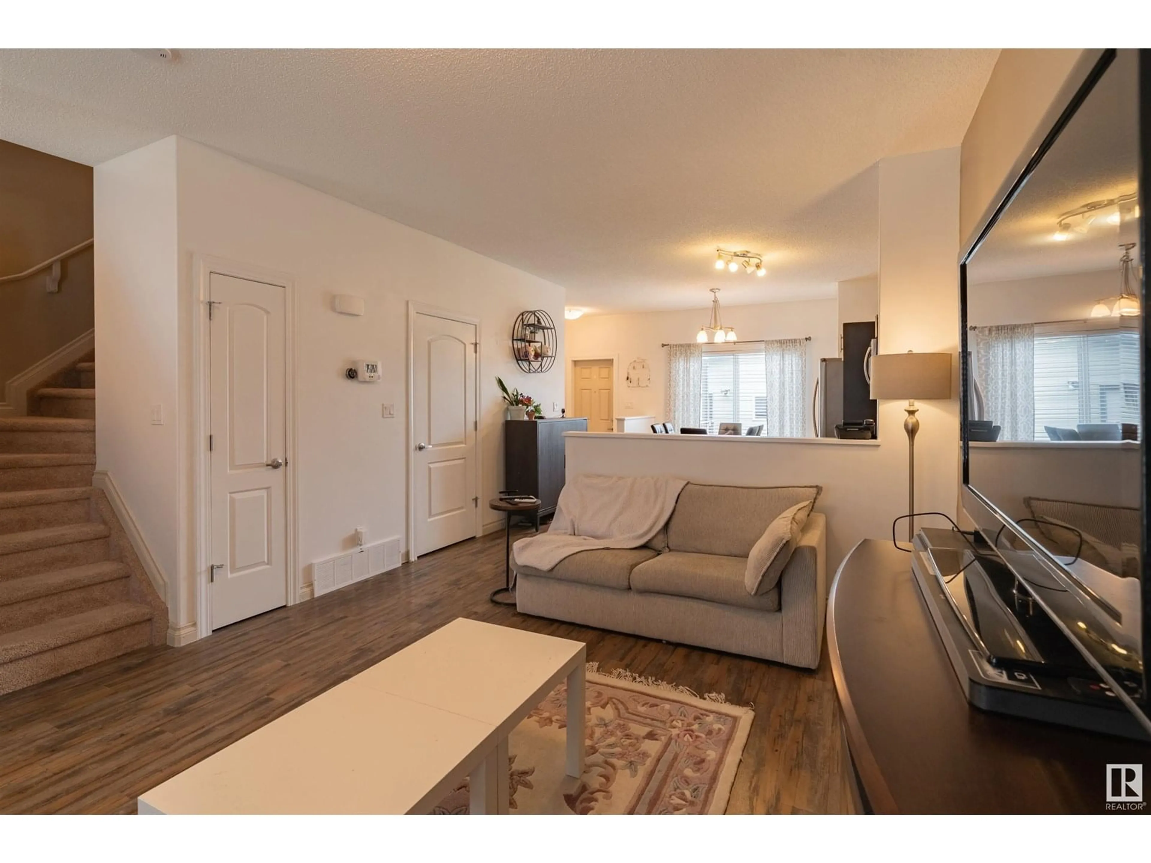 Living room with furniture, wood/laminate floor for 16728 120 ST, Edmonton Alberta T5X0G5