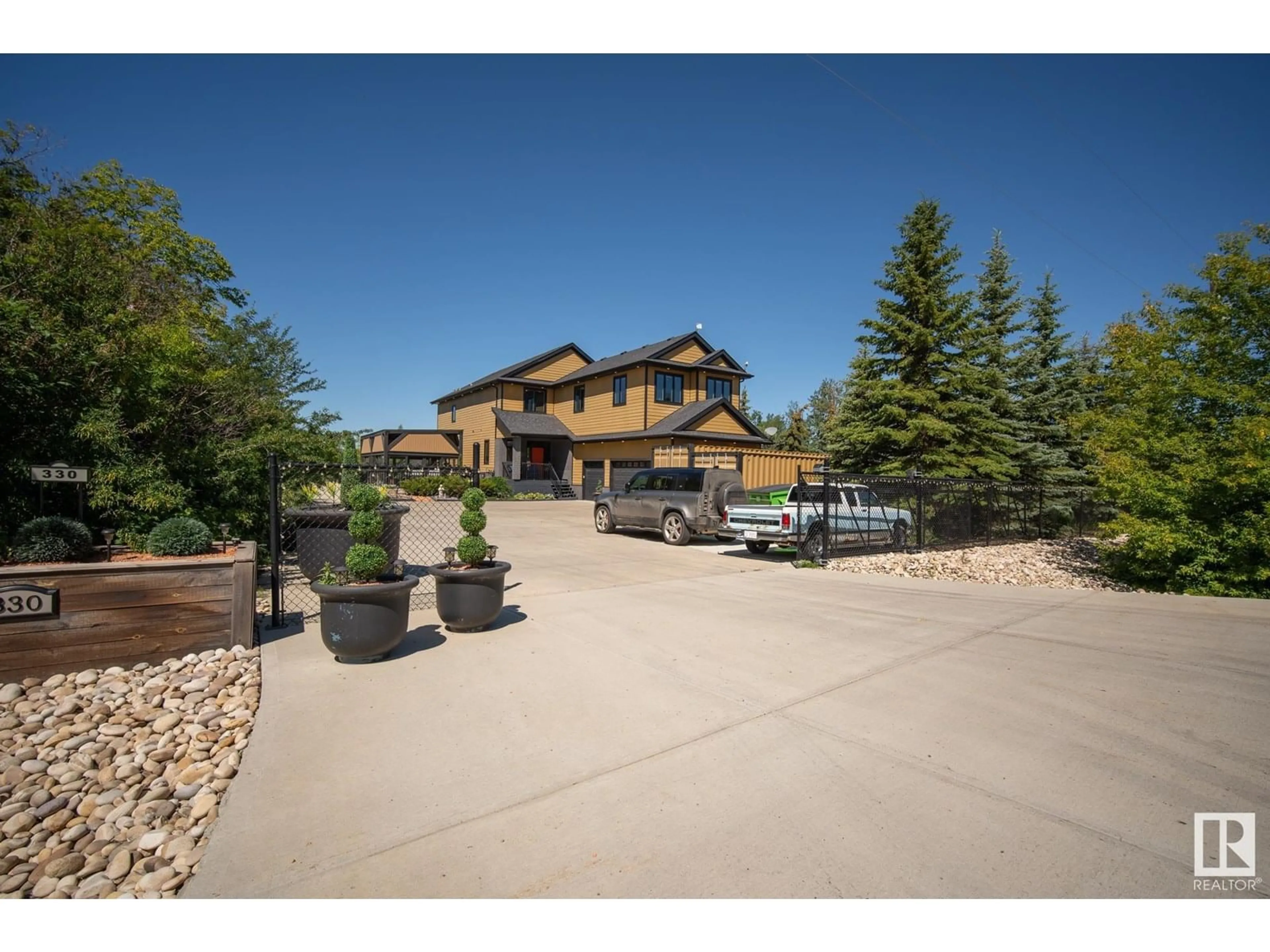A pic from outside/outdoor area/front of a property/back of a property/a pic from drone, mountain view for 330 23549 TWP ROAD 510, Rural Leduc County Alberta T4X0T1
