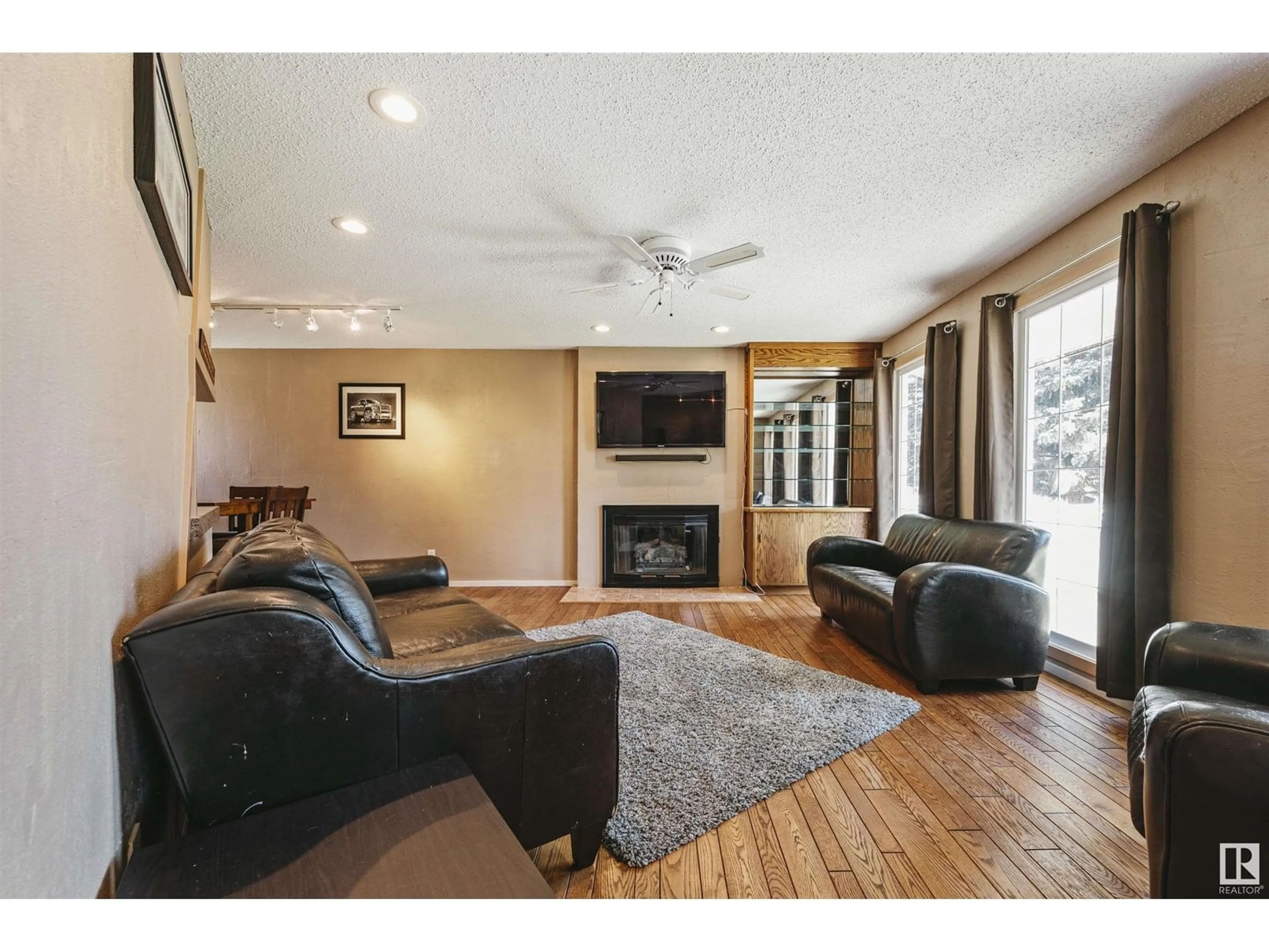Living room with furniture, wood/laminate floor for 4415 54 AV, Beaumont Alberta T4X1J6