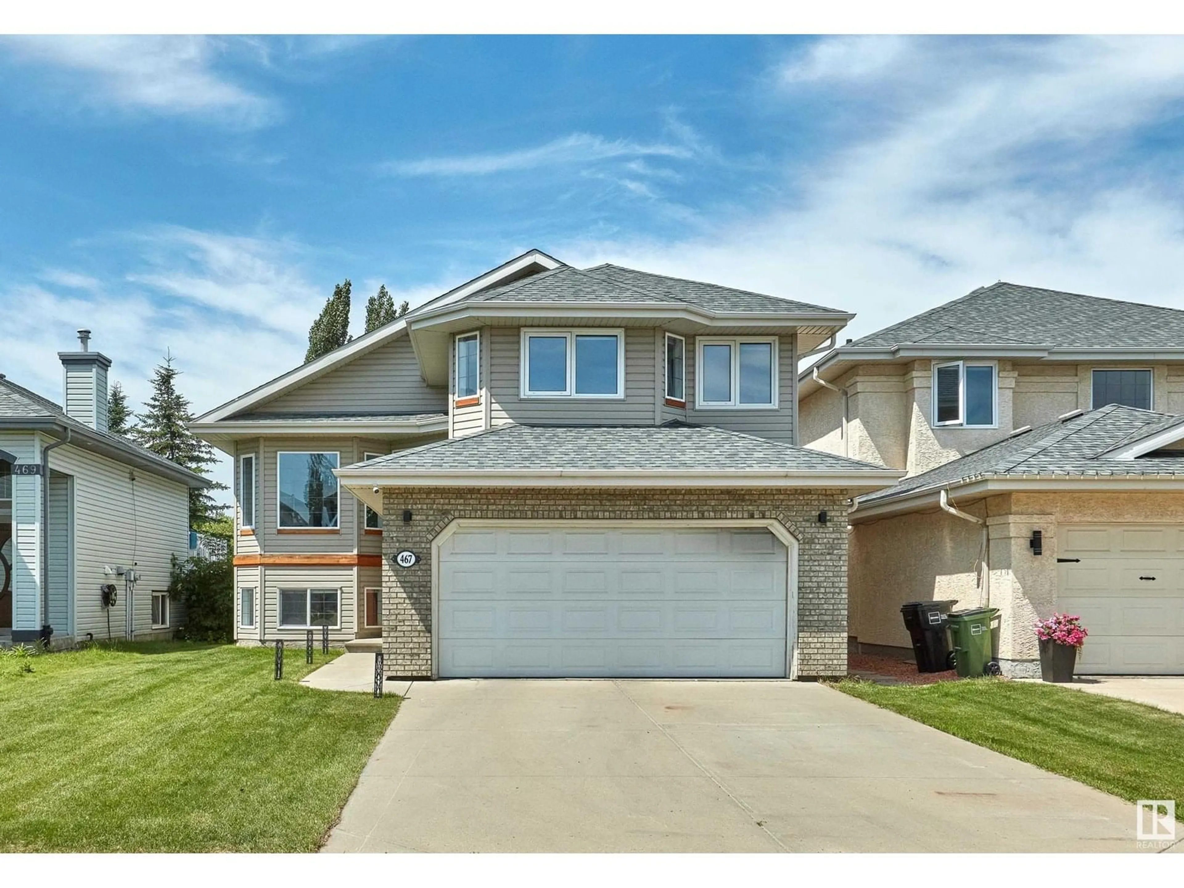 Home with vinyl exterior material, street for NW - 467 HUNTERS GREEN GR, Edmonton Alberta T6R3C3