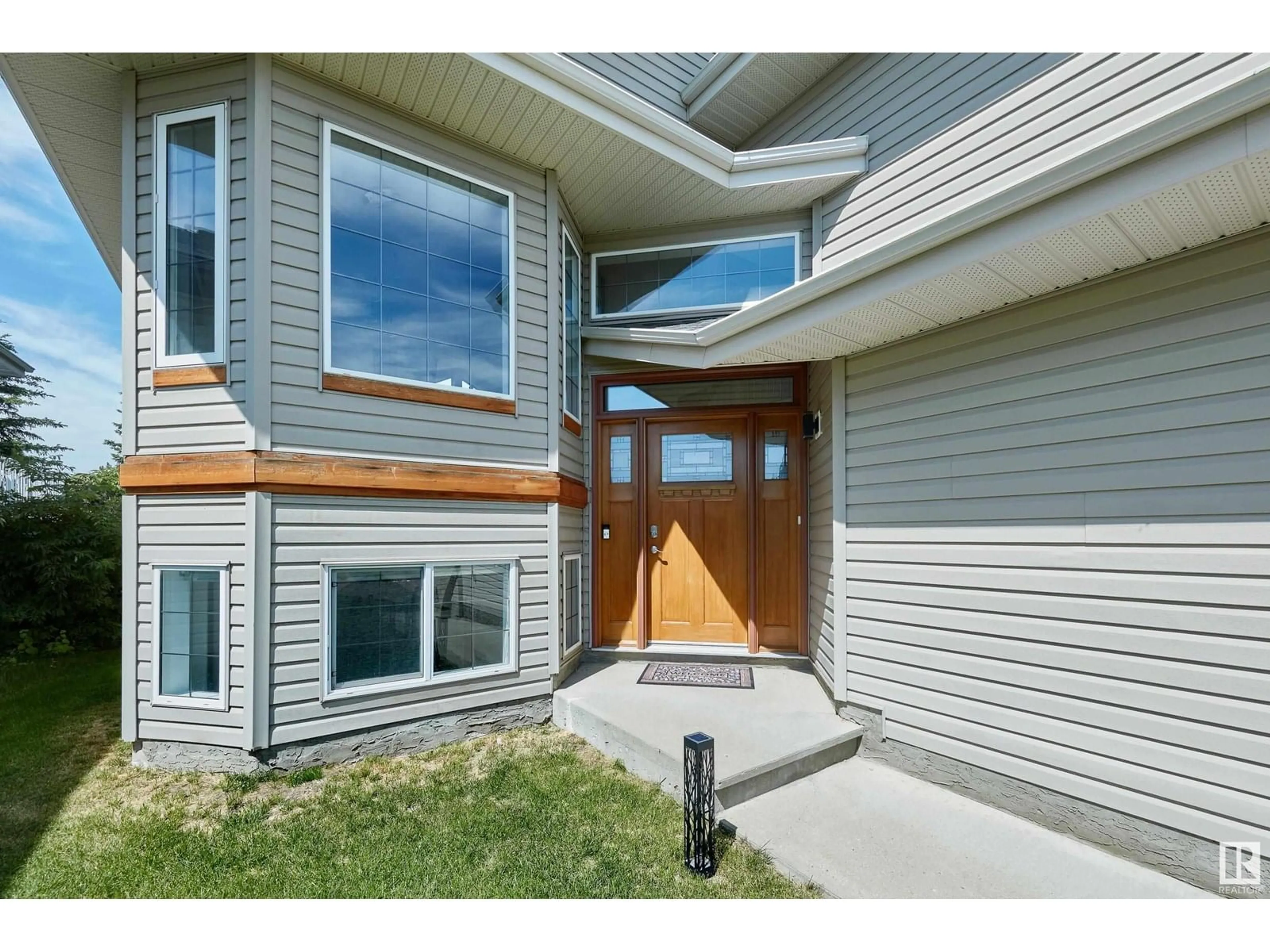 Home with vinyl exterior material, street for NW - 467 HUNTERS GREEN GR, Edmonton Alberta T6R3C3