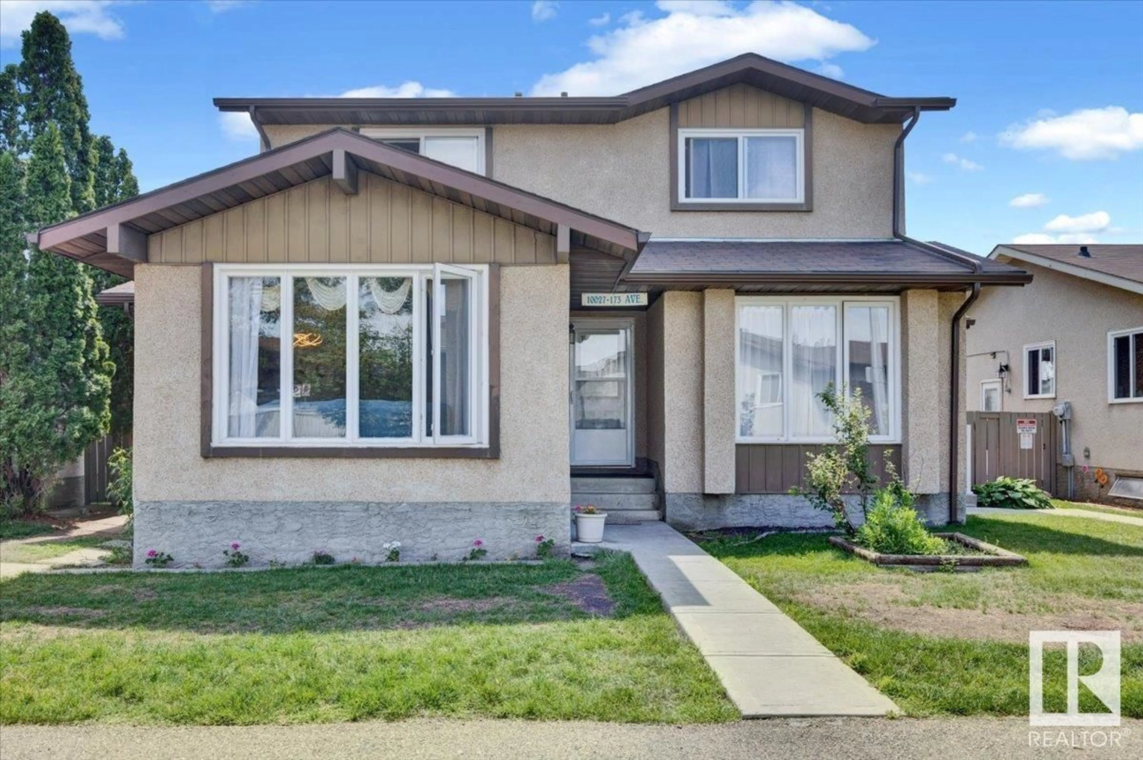 Home with vinyl exterior material, street for 10027 173 AVE, Edmonton Alberta T5X3Y1