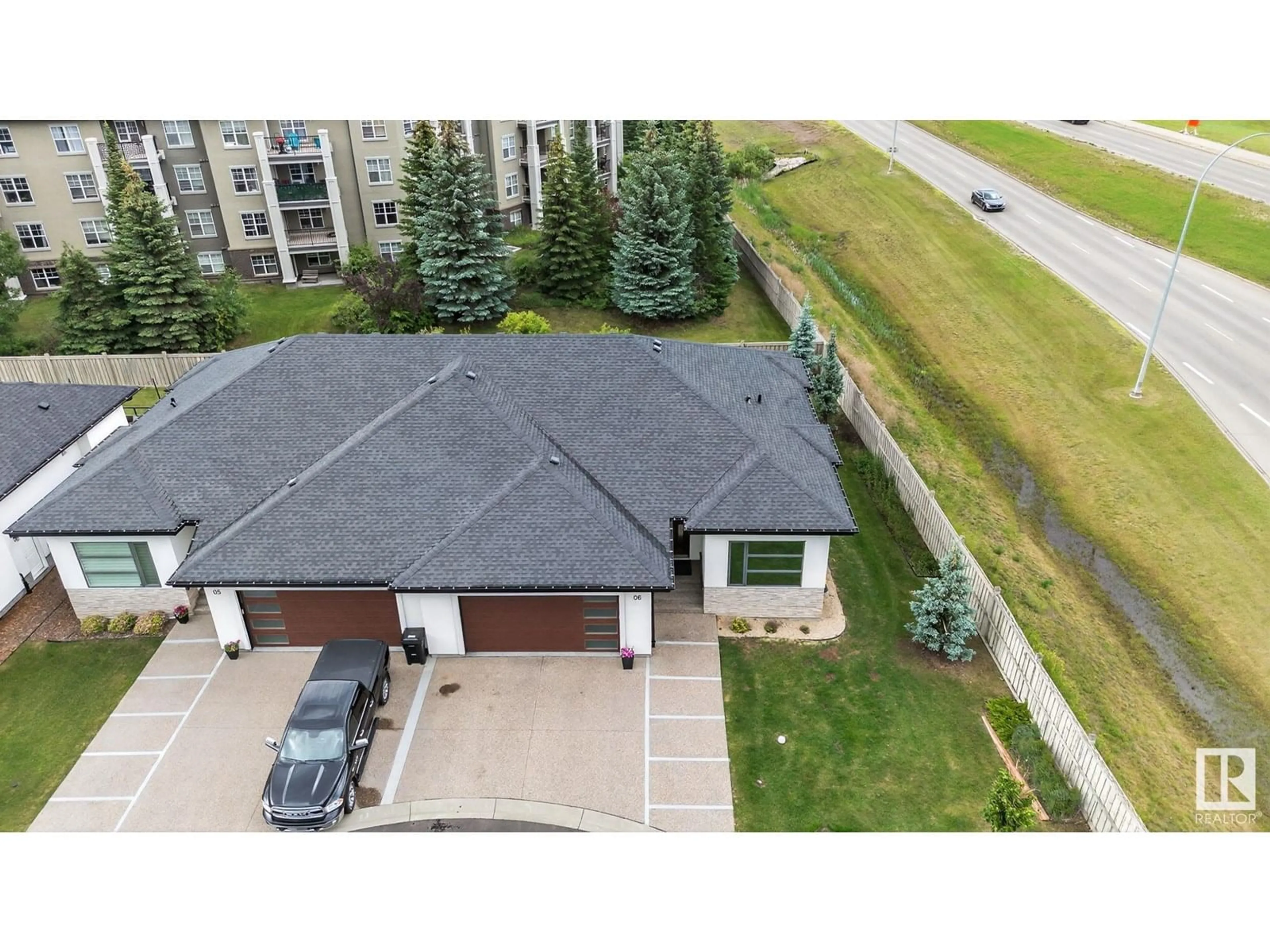 A pic from outside/outdoor area/front of a property/back of a property/a pic from drone, unknown for #6 - 604 MCALLISTER LO, Edmonton Alberta T6L3L4