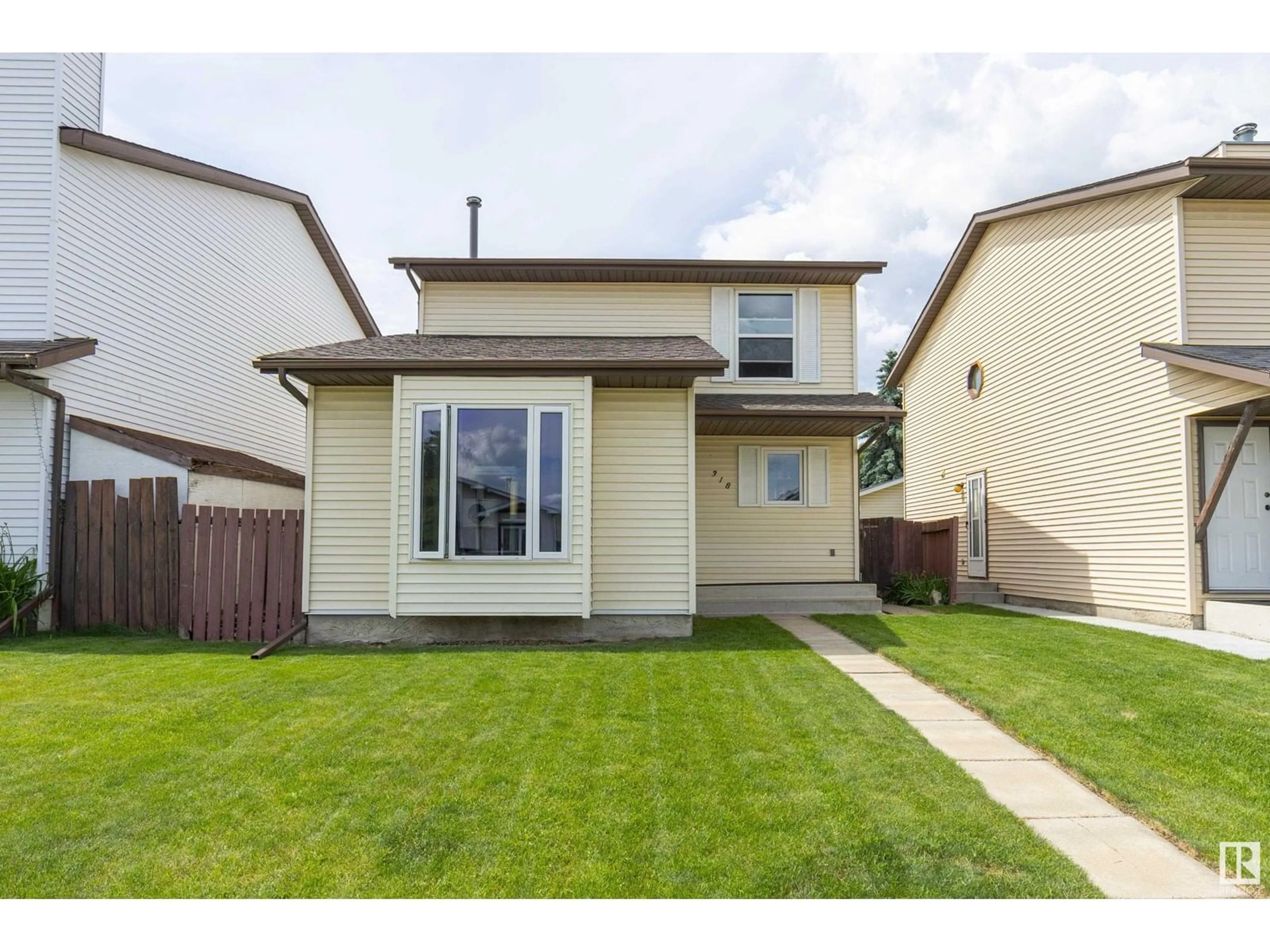 Home with vinyl exterior material, street for 318 KIRKPATRICK CR, Edmonton Alberta T5L5E1