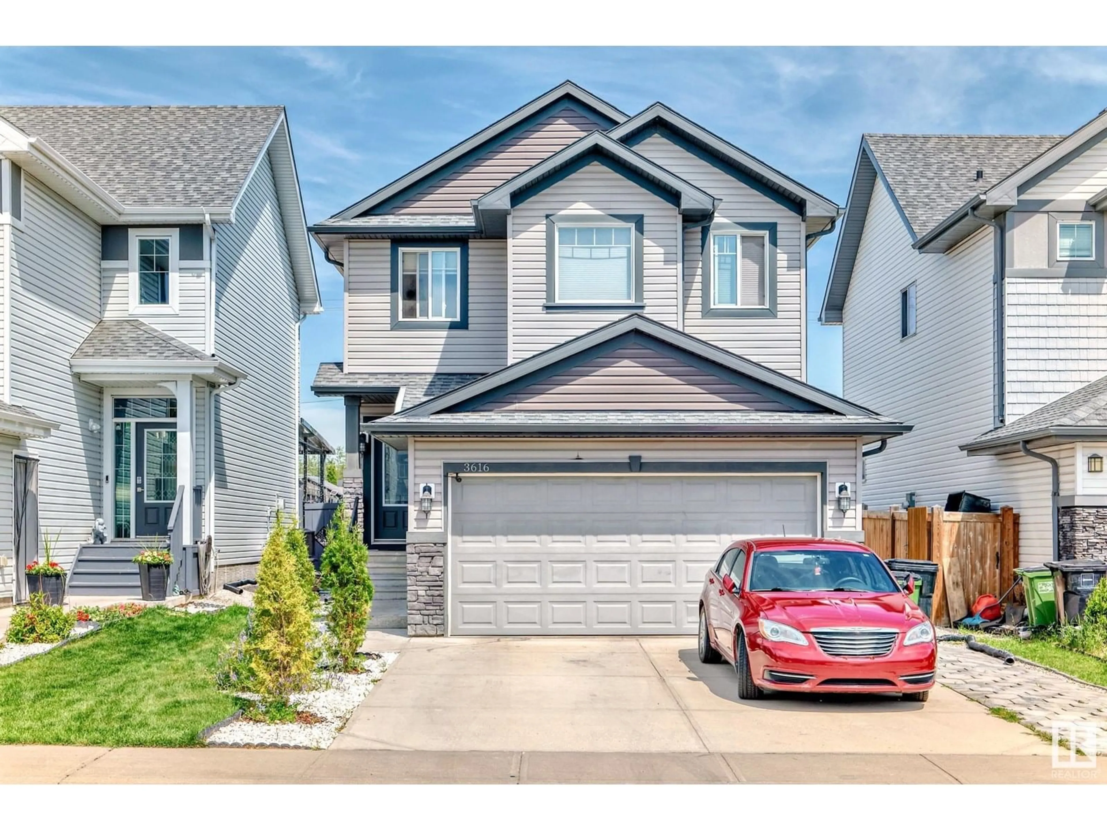 Home with vinyl exterior material, street for NW - 3616 168 AV, Edmonton Alberta T5Y0X8