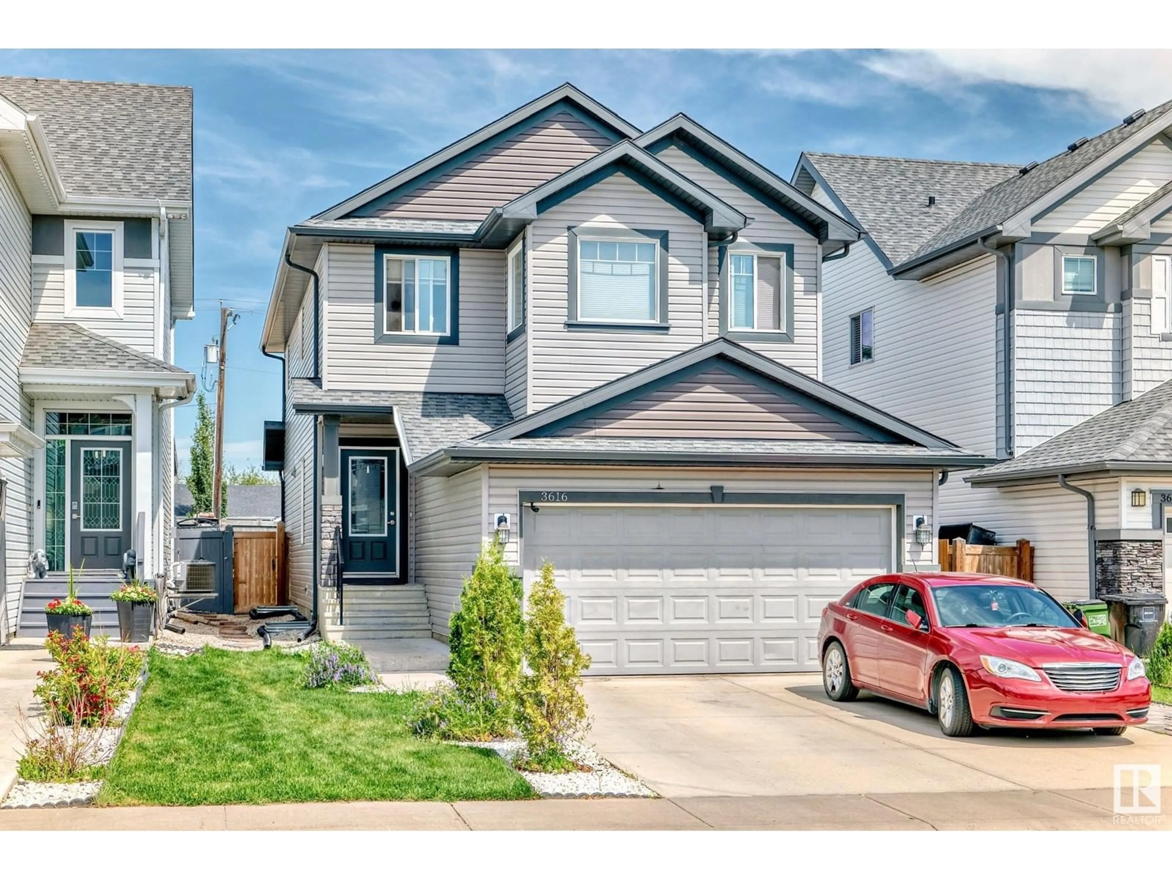 Home with vinyl exterior material, street for NW - 3616 168 AV, Edmonton Alberta T5Y0X8