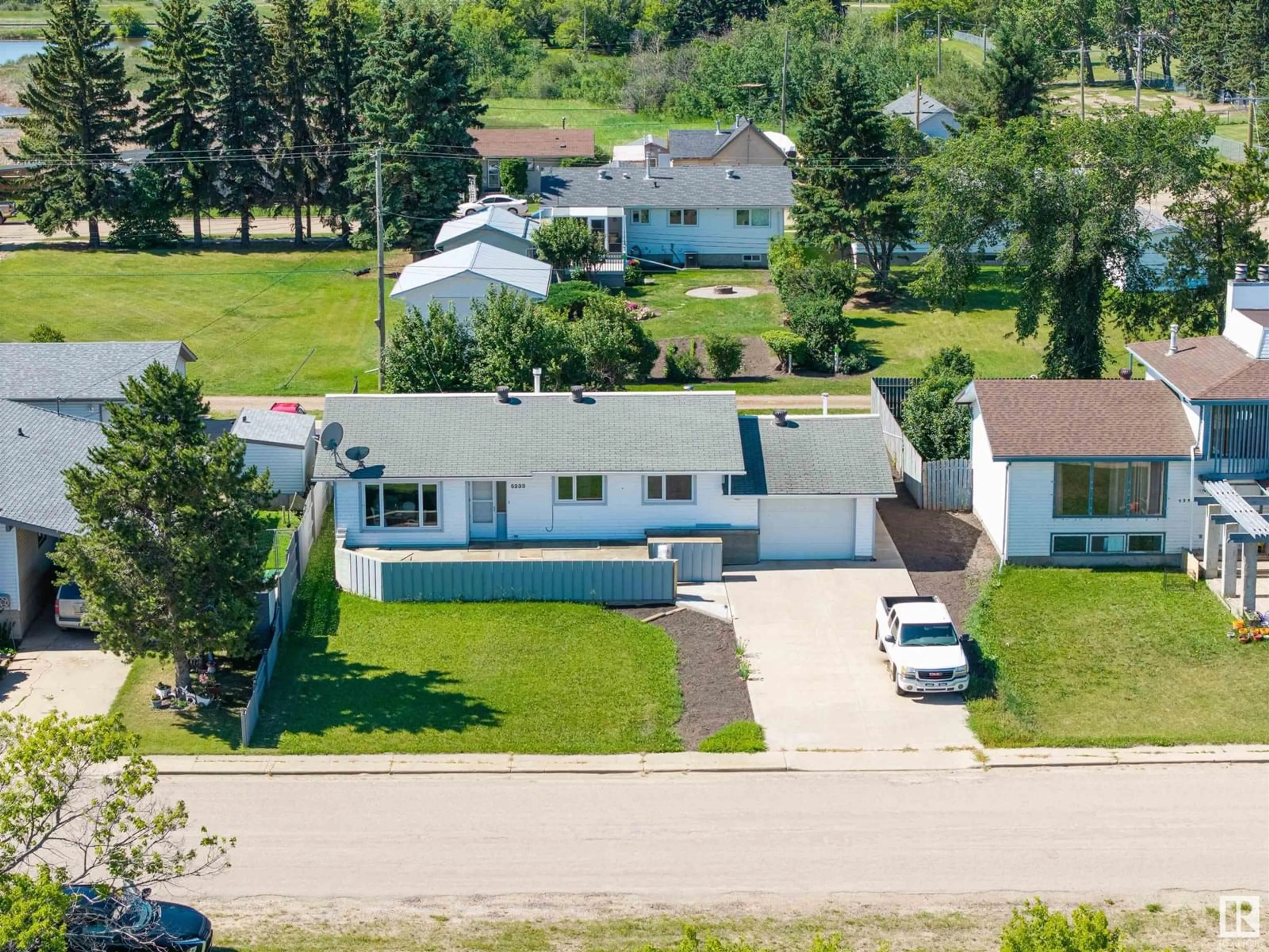 A pic from outside/outdoor area/front of a property/back of a property/a pic from drone, street for 5233 51 AV, Holden Alberta T0B2C0