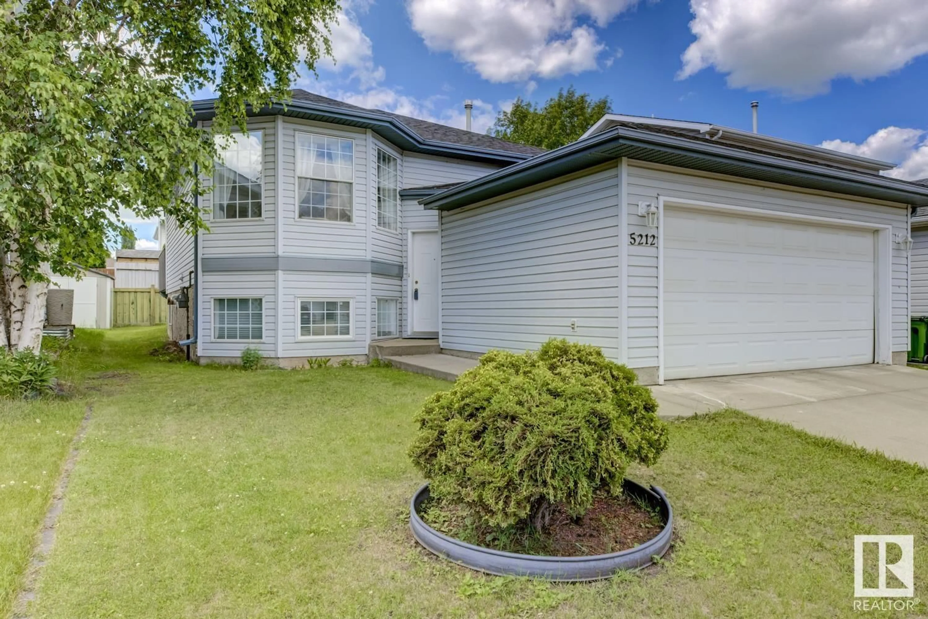 Home with vinyl exterior material, street for 5212 138A AV, Edmonton Alberta T5A4Z6