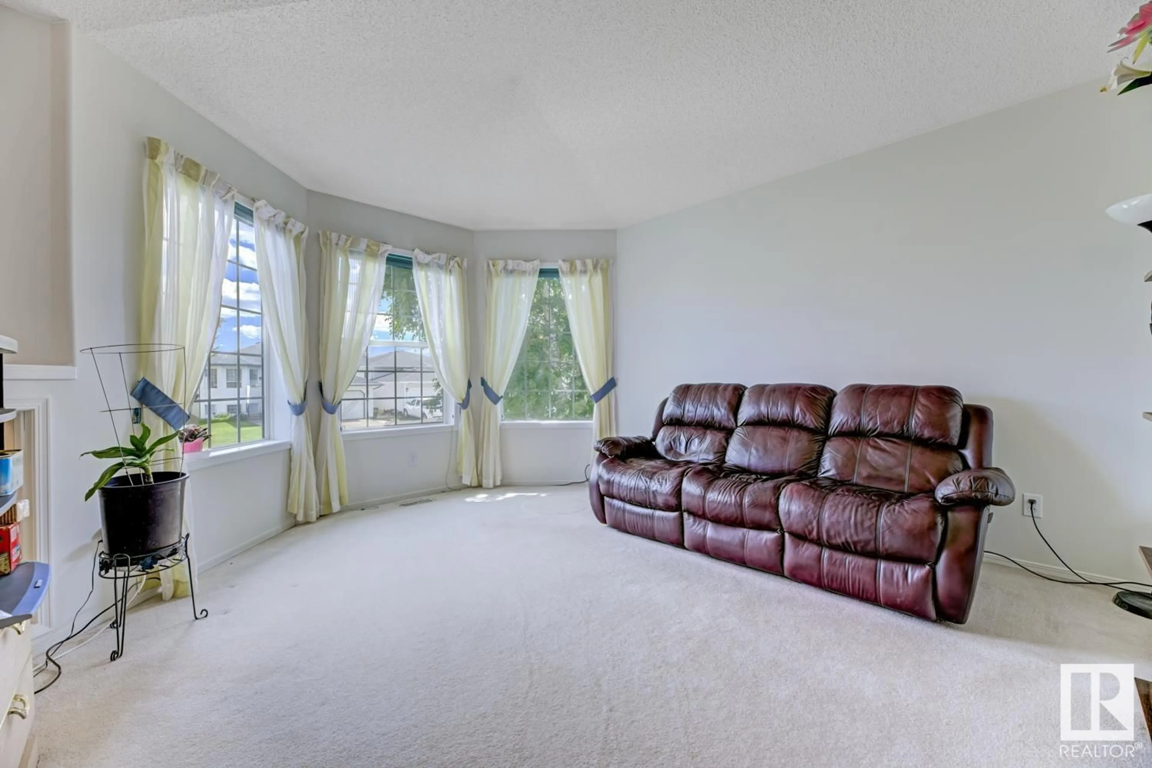 Living room with furniture, unknown for 5212 138A AV, Edmonton Alberta T5A4Z6