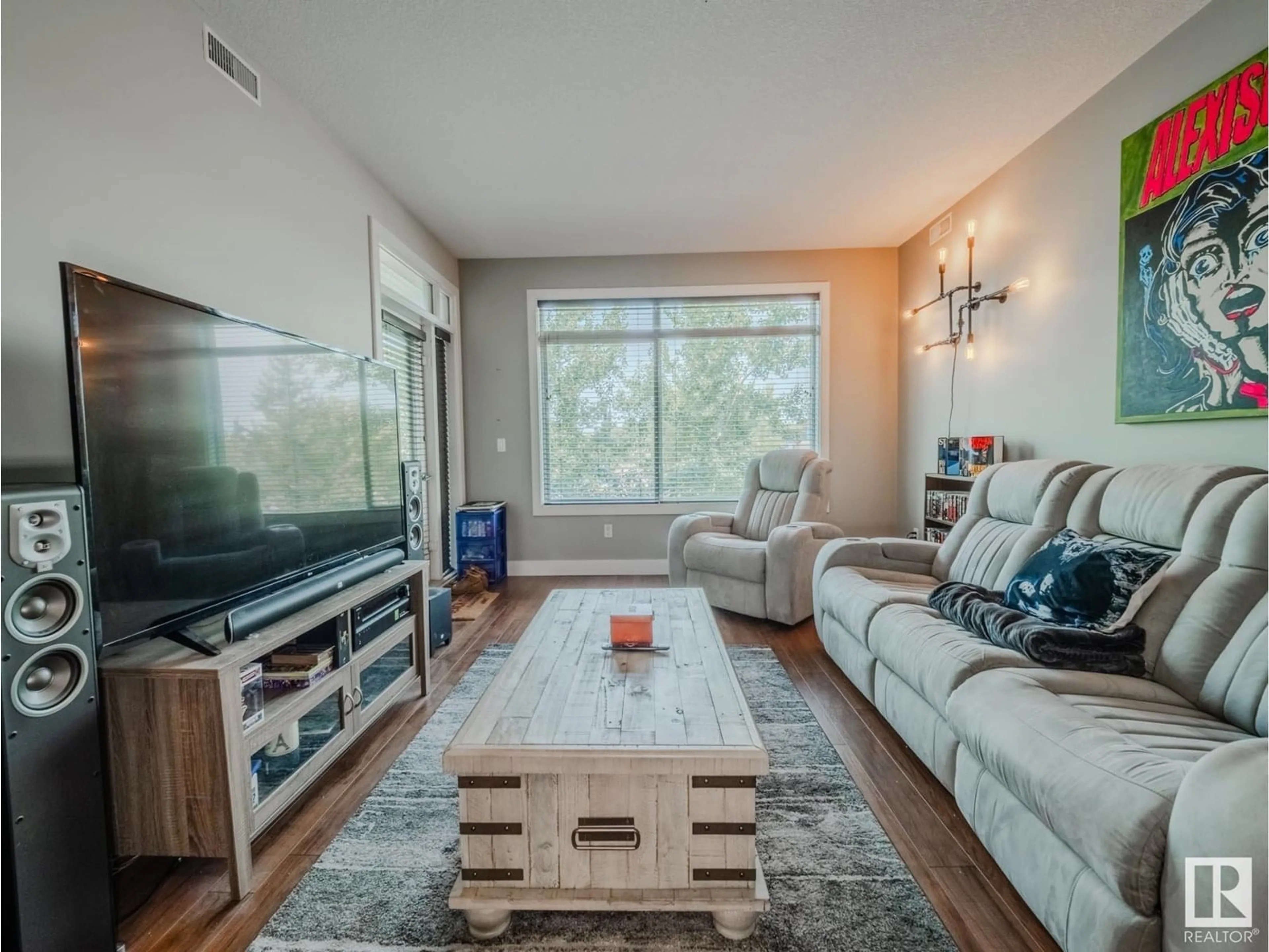 Living room with furniture, wood/laminate floor for #213 - 279 WYE RD, Sherwood Park Alberta T8B0A7