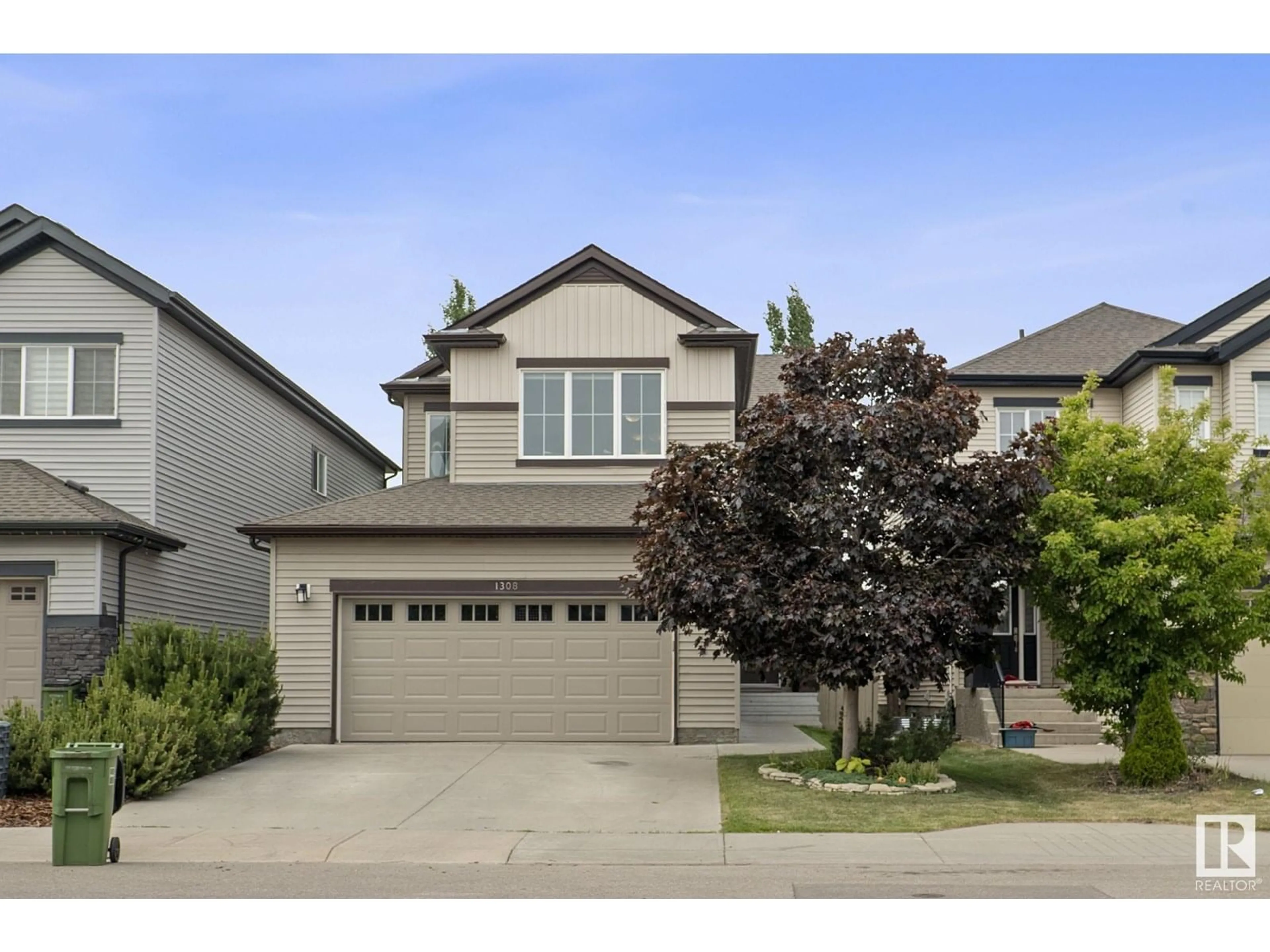 Home with vinyl exterior material, street for 1308 56 ST, Edmonton Alberta T6W1R4
