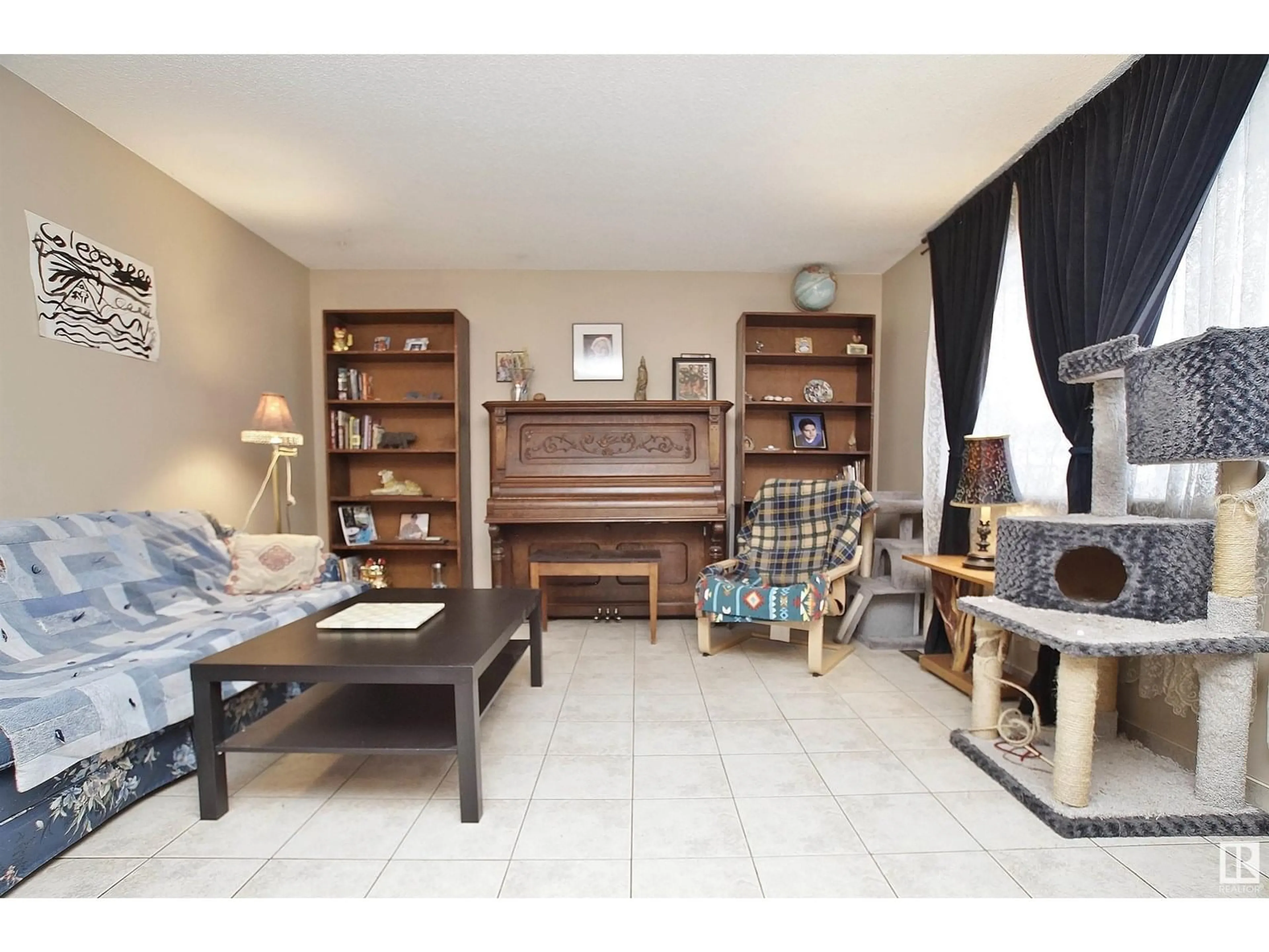 Living room with furniture, unknown for 8318 122 AV, Edmonton Alberta T5B4M7