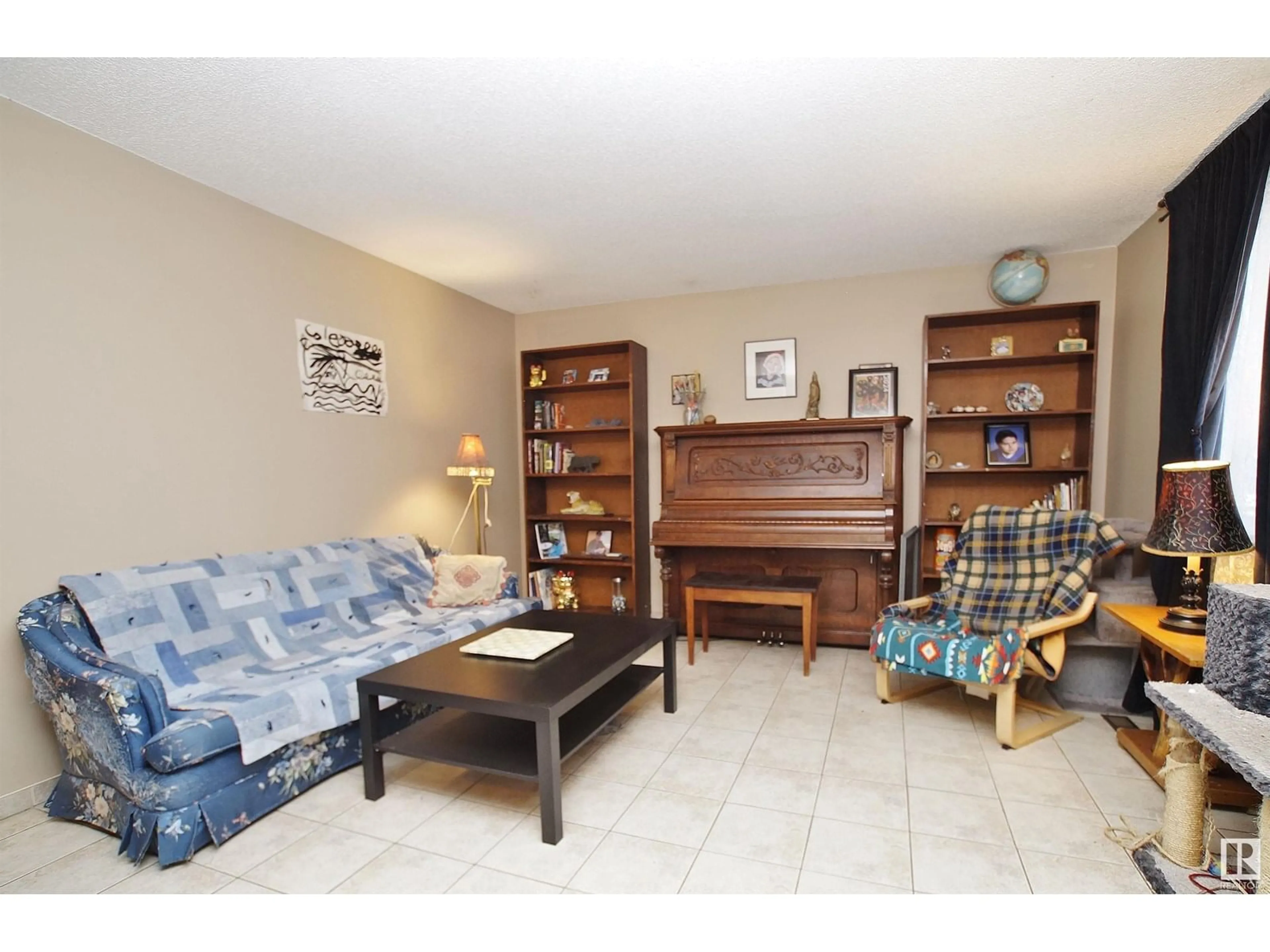 Living room with furniture, unknown for 8318 122 AV, Edmonton Alberta T5B4M7