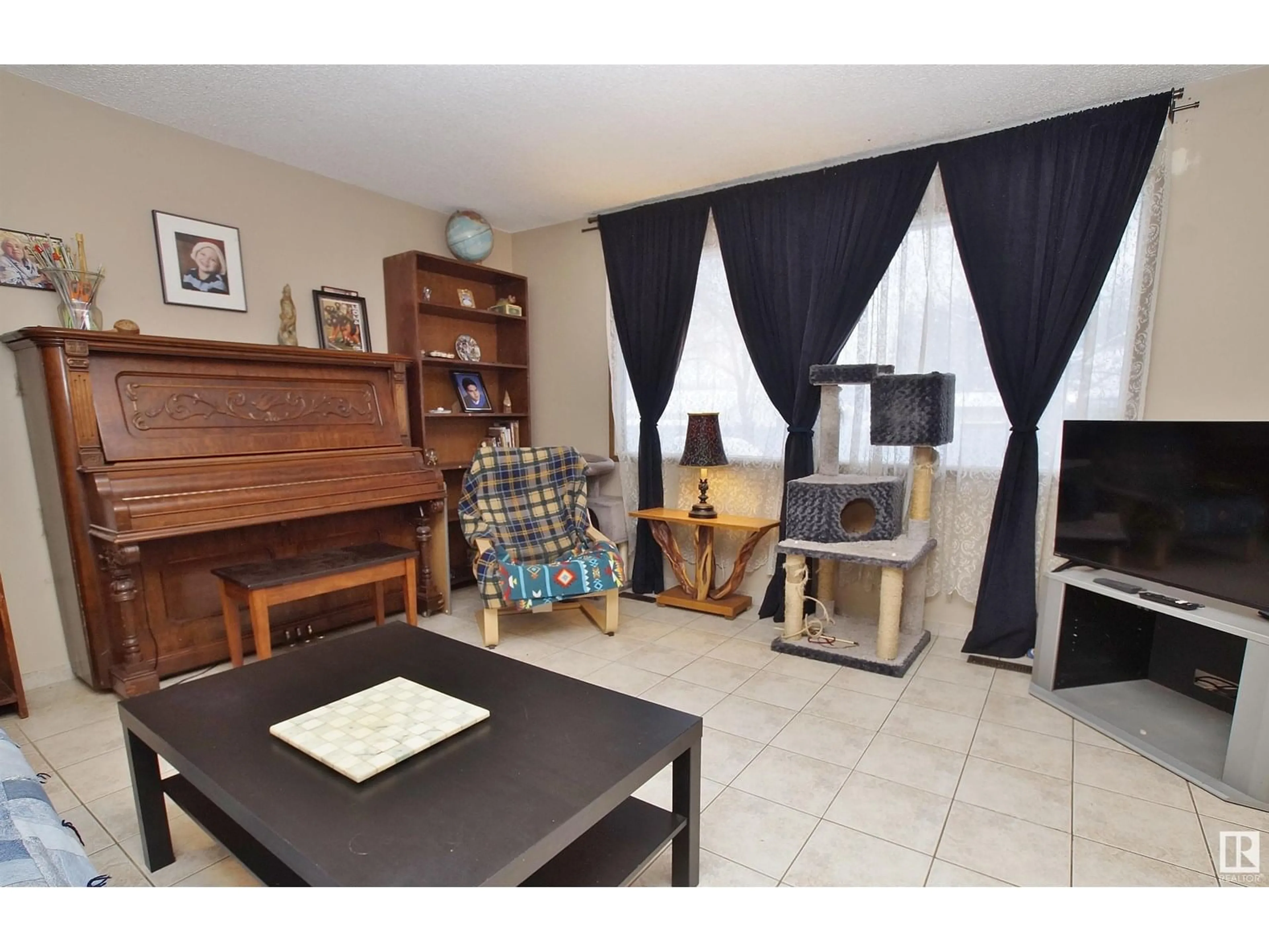 Living room with furniture, unknown for 8318 122 AV, Edmonton Alberta T5B4M7