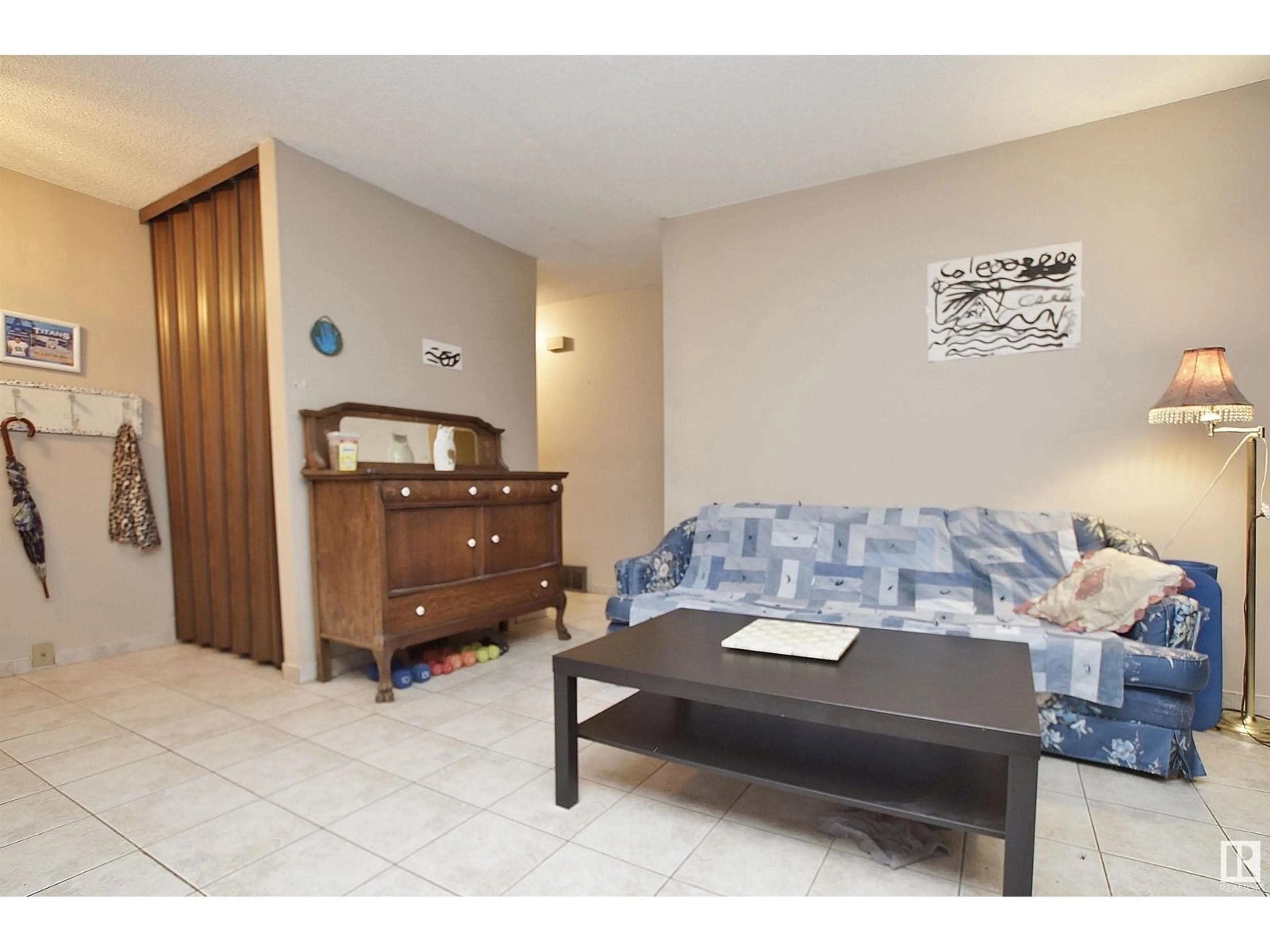 Living room with furniture, unknown for 8318 122 AV, Edmonton Alberta T5B4M7