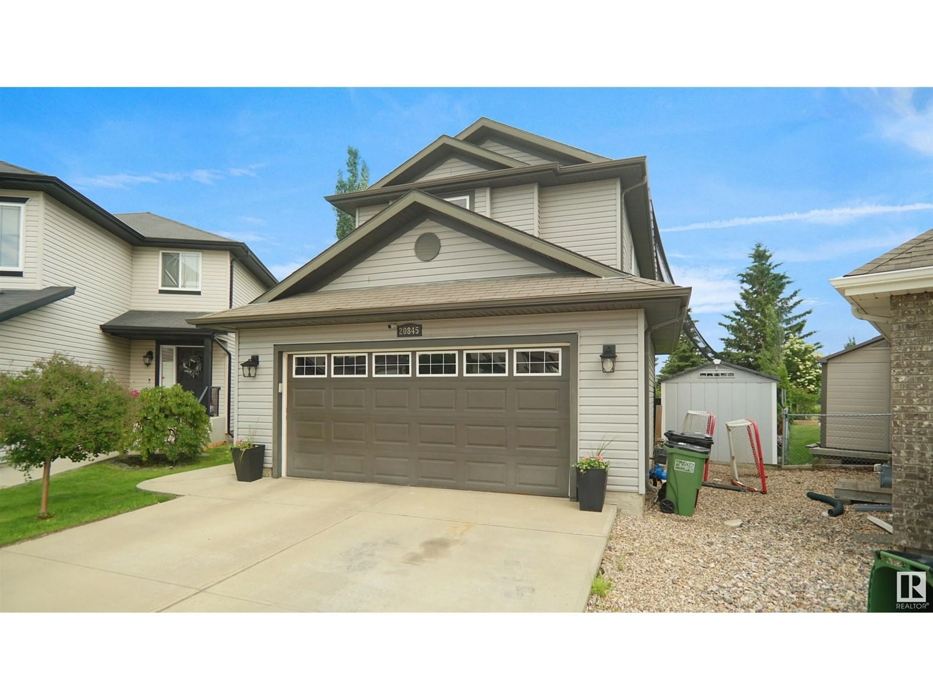 Home with vinyl exterior material, street for 20845 92A AV, Edmonton Alberta T5T3Z1