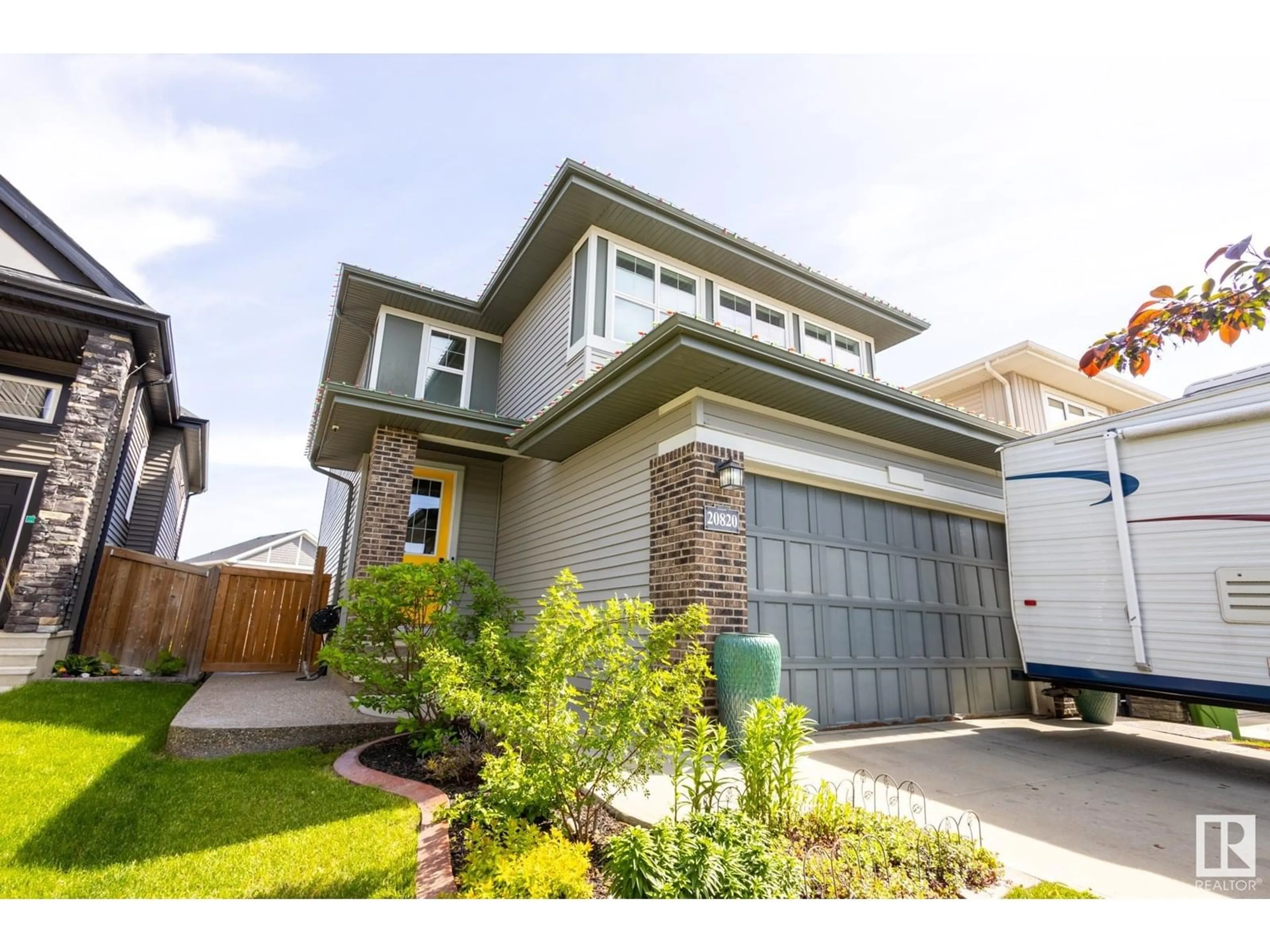 Home with vinyl exterior material, street for NW - 20820 130 AV, Edmonton Alberta T5S0L4