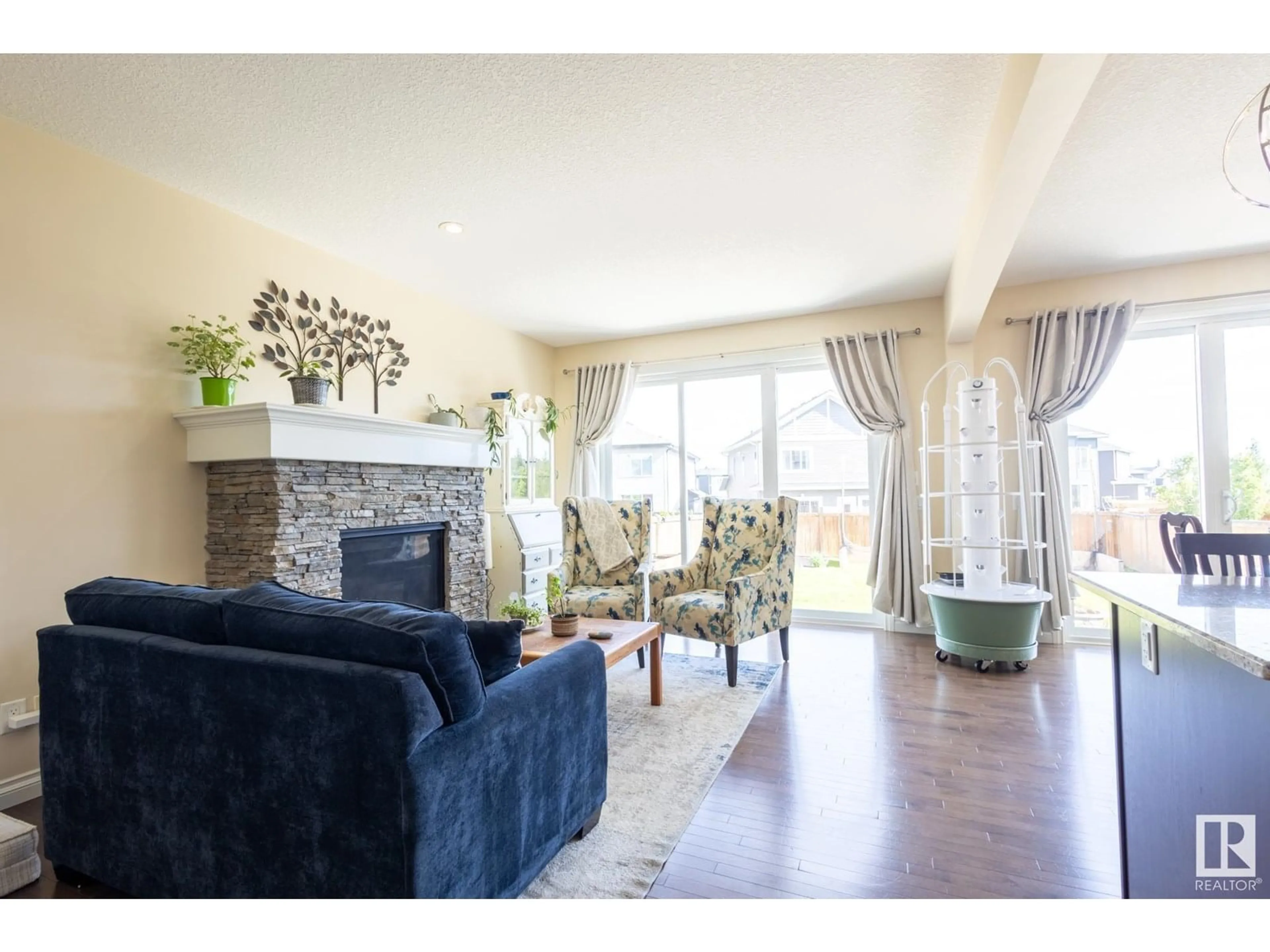 Living room with furniture, wood/laminate floor for NW - 20820 130 AV, Edmonton Alberta T5S0L4